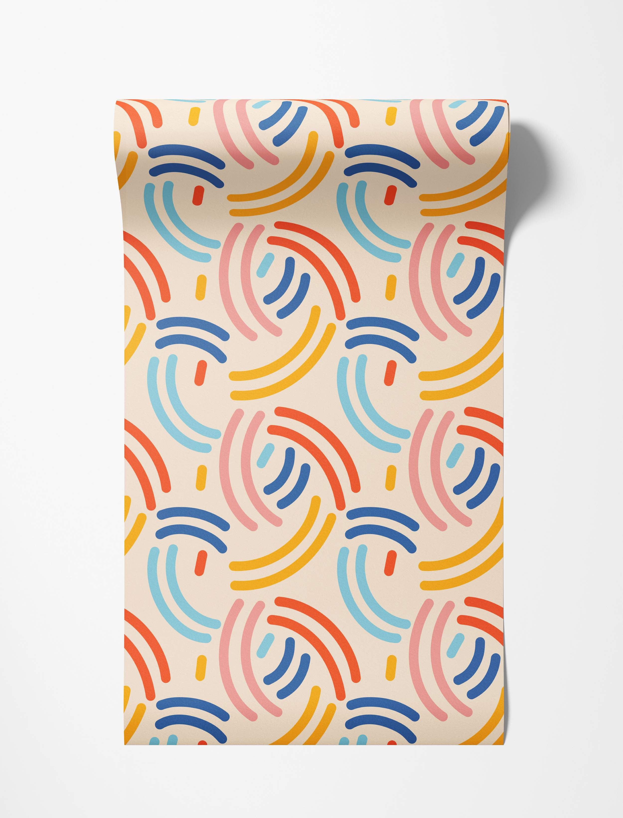 Wallpaper featuring a playful abstract pattern of repeating curved arches in red, blue, yellow, pink, and light blue.