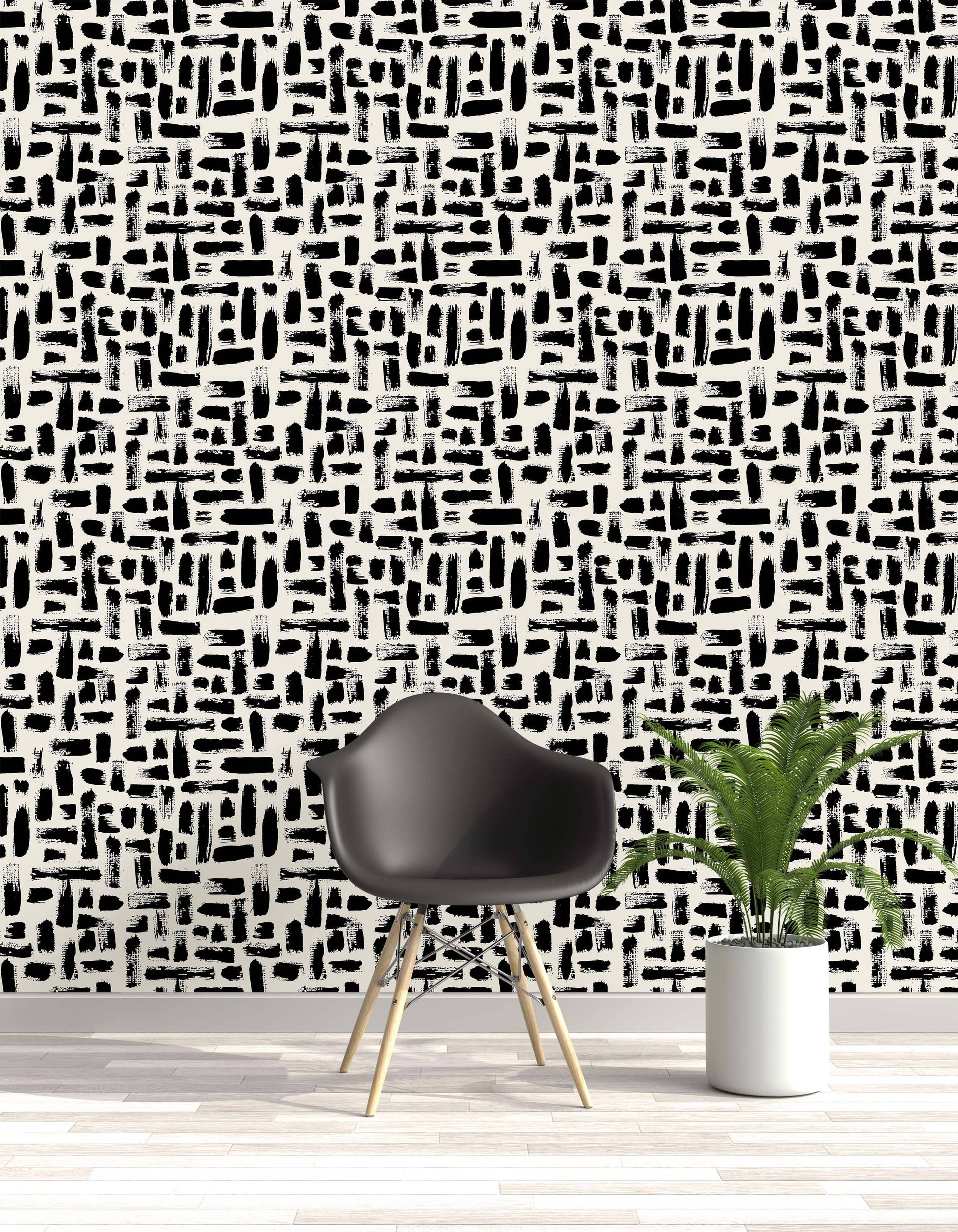 Abstract wallpaper featuring rough, textured black brush strokes scattered horizontally and vertically on an off-white background.