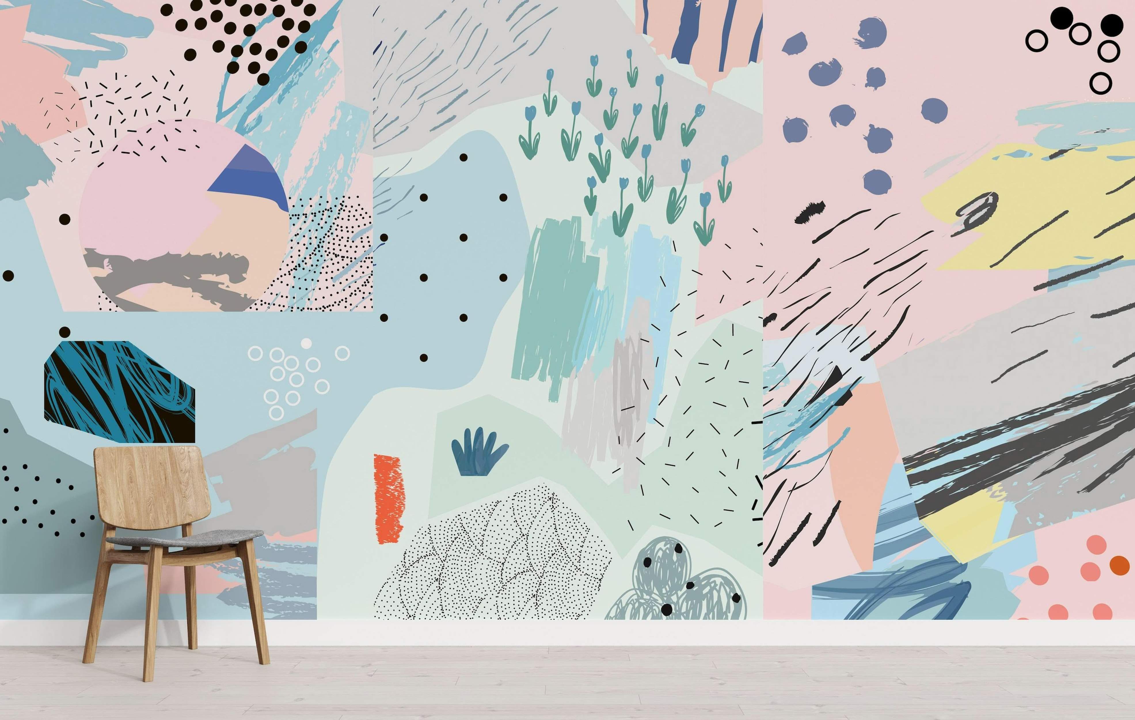 Mural with an abstract collage design in pastel blues, pinks, and yellows, featuring dots, dashes, and textured brush strokes.