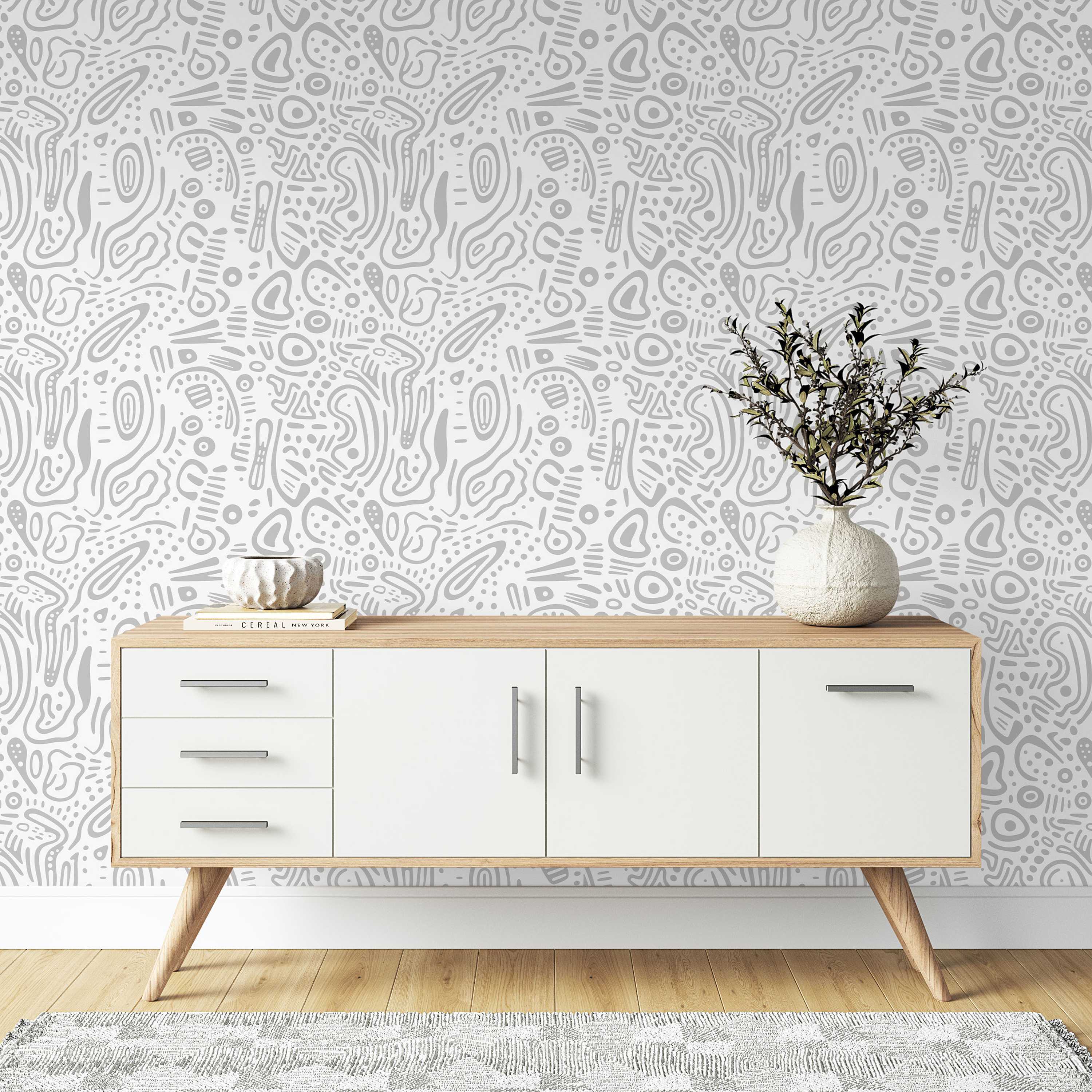 Wallpaper featuring a pattern of abstract, hand-drawn organic shapes, lines, and dots in light gray on a white background.