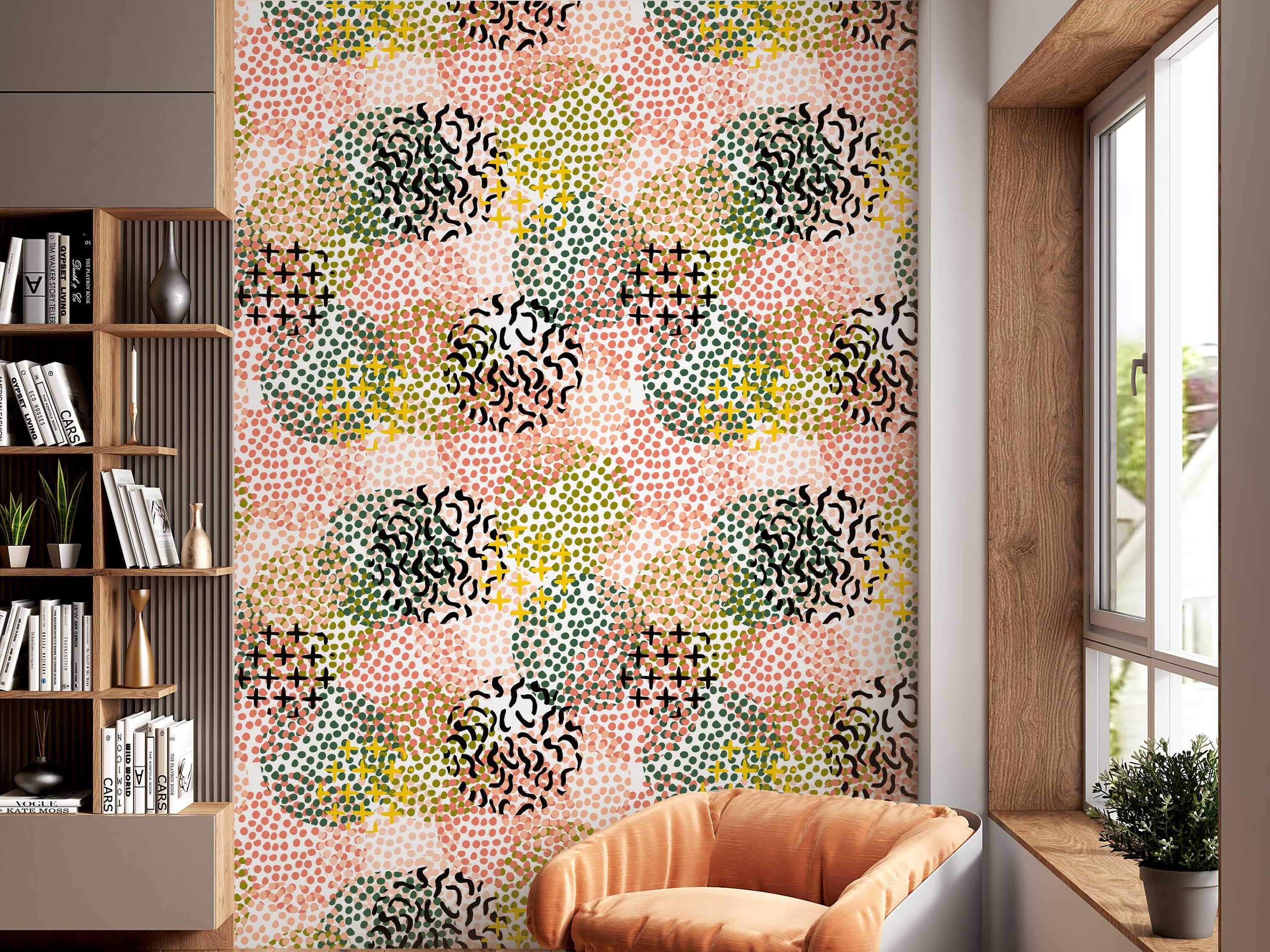 Abstract wallpaper with overlapping clusters of pink, dark green, and olive dots, accented by yellow and black crosses and squiggles.