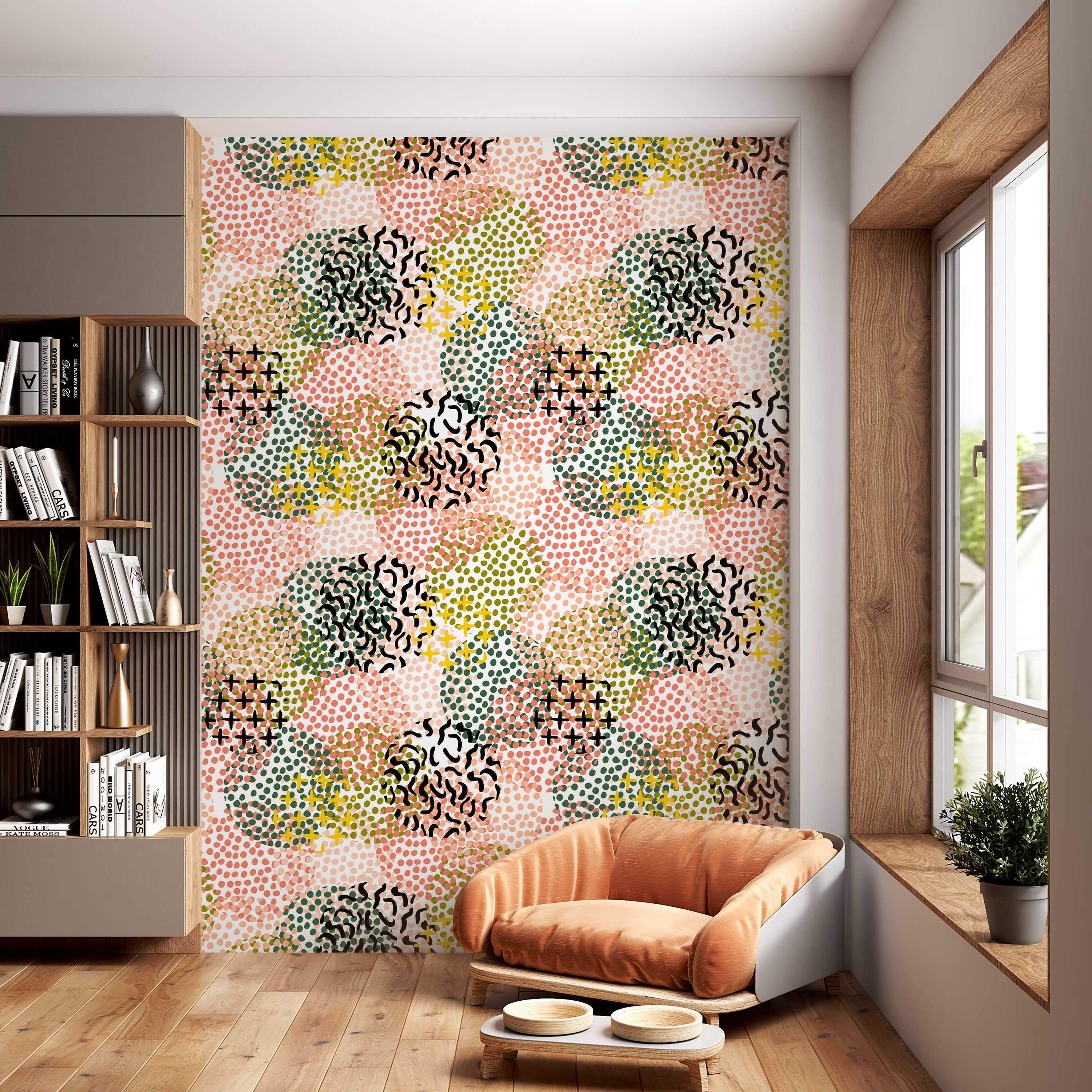 Abstract wallpaper with overlapping clusters of pink, dark green, and olive dots, accented by yellow and black crosses and squiggles.