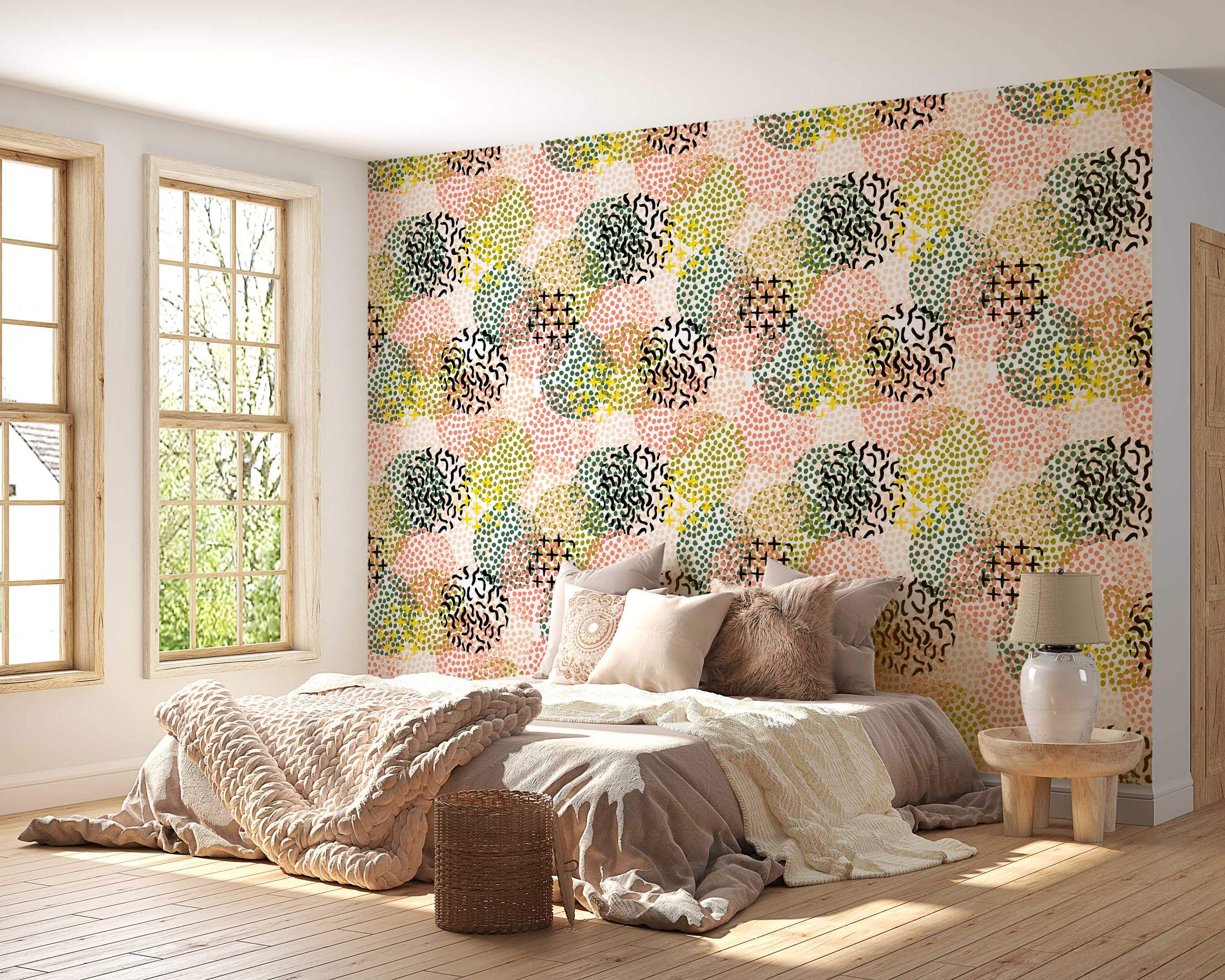 Abstract wallpaper with overlapping dotted circles in pink, green, yellow, and black shapes with squiggle and plus sign details.