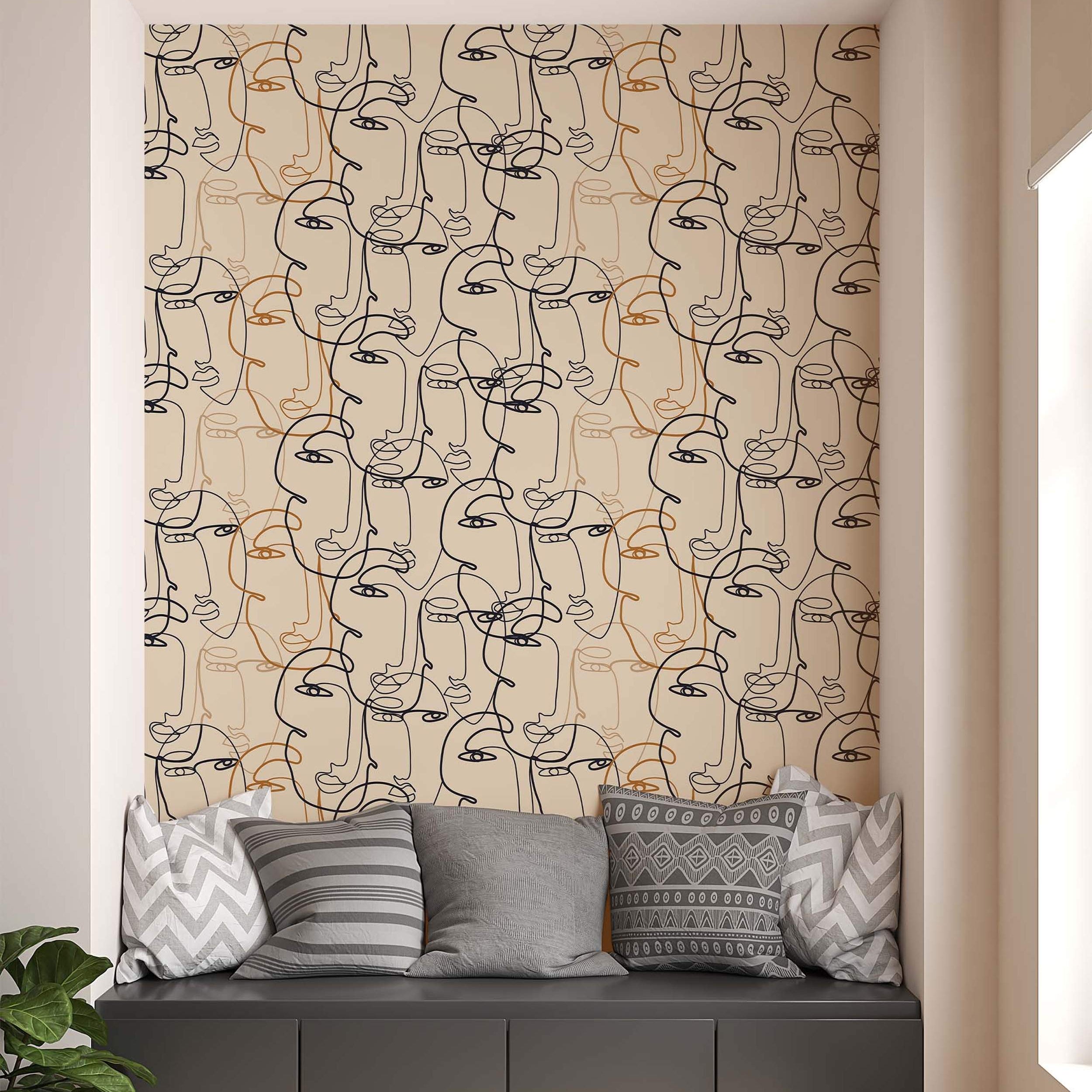 Abstract wallpaper featuring continuous line art faces in black and brown on a light beige background.