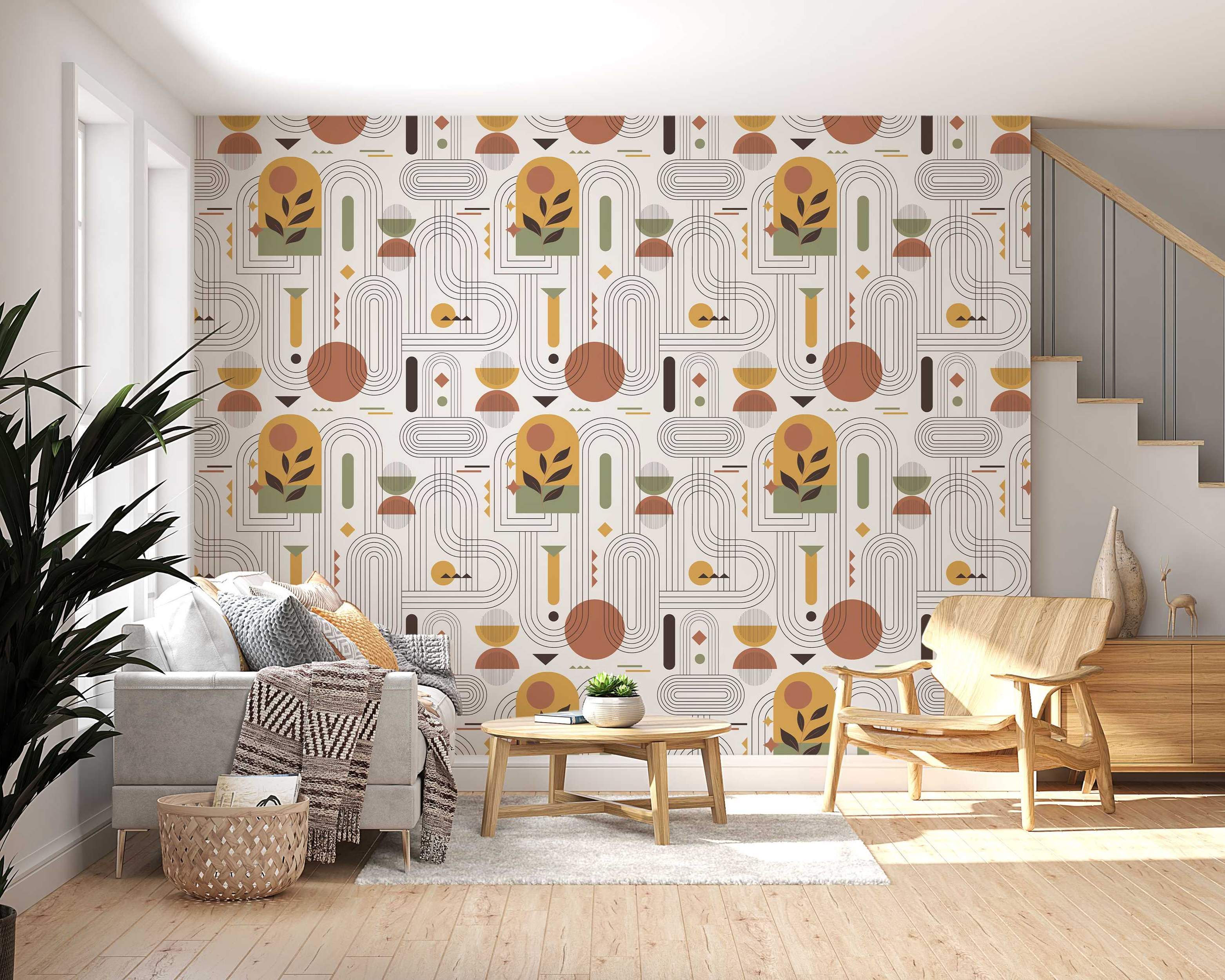 Abstract geometric wallpaper featuring arches, lines, and botanical motifs in earthy tones of terracotta, green, yellow, and brown on cream.