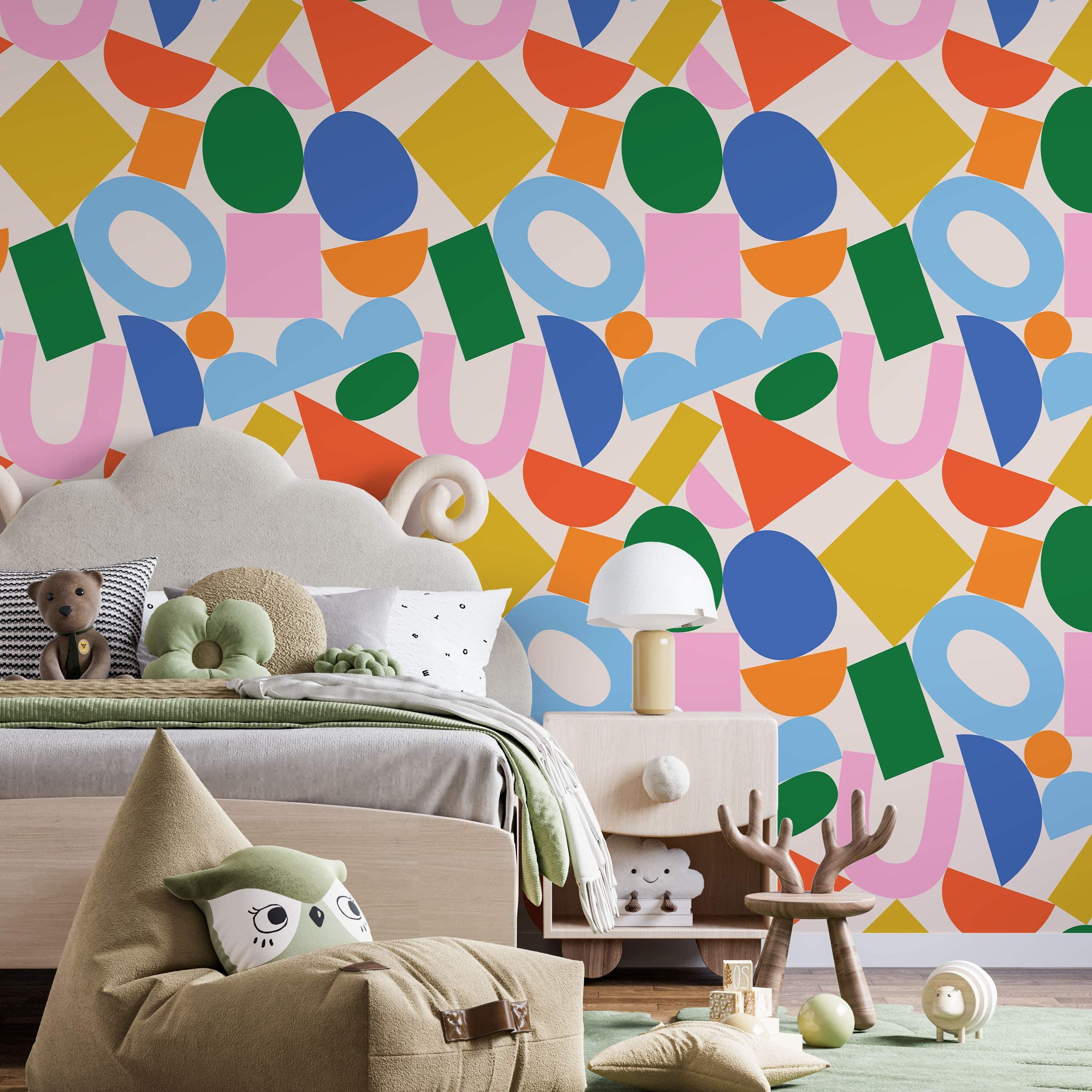 Abstract wallpaper featuring a playful mix of colorful geometric shapes like circles, squares, and U-shapes on a light background.