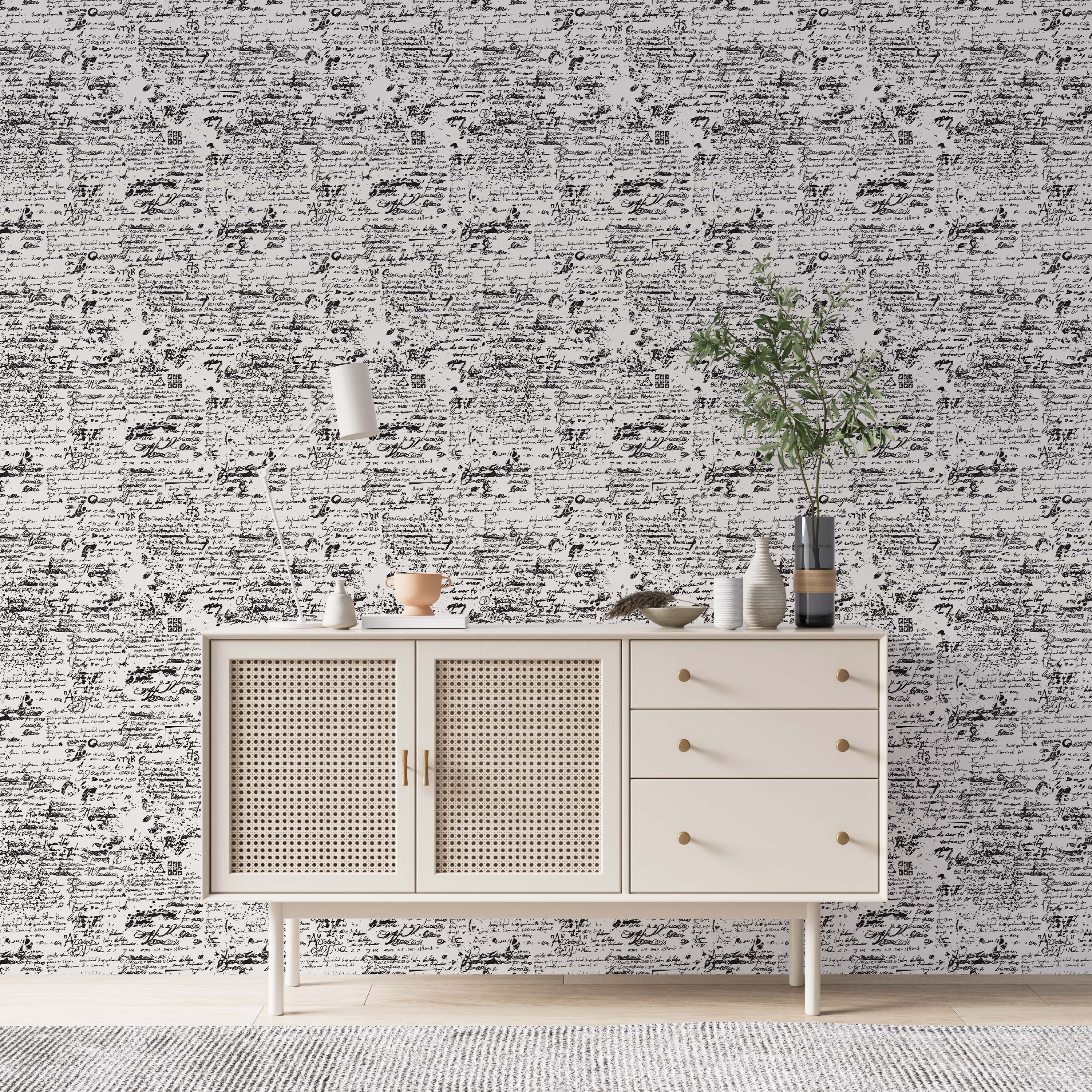 Abstract wallpaper with a repeating pattern of layered, distressed black handwritten script on a white background.
