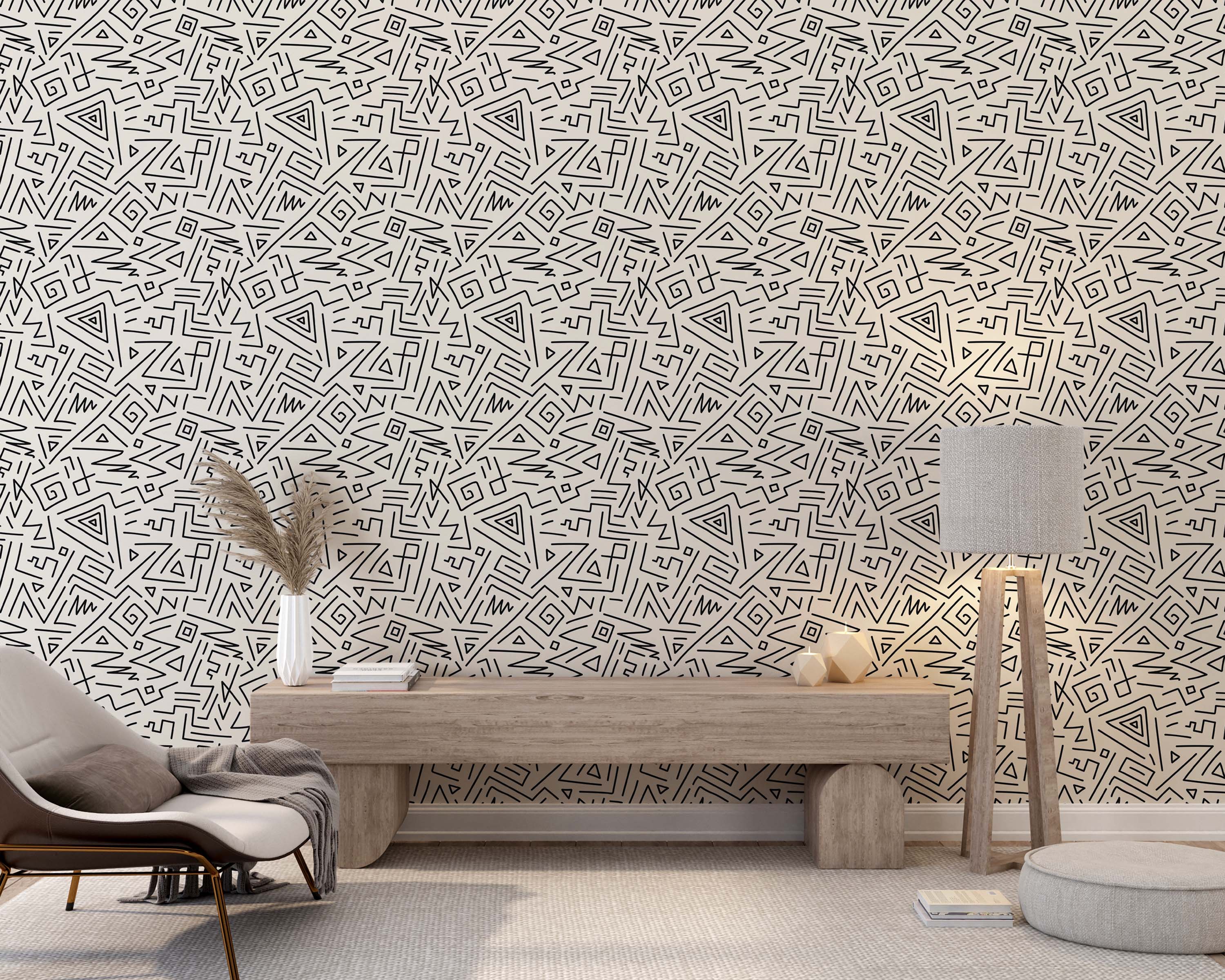 Busy wallpaper with an abstract black line design, including triangles and spirals, on a light beige background.