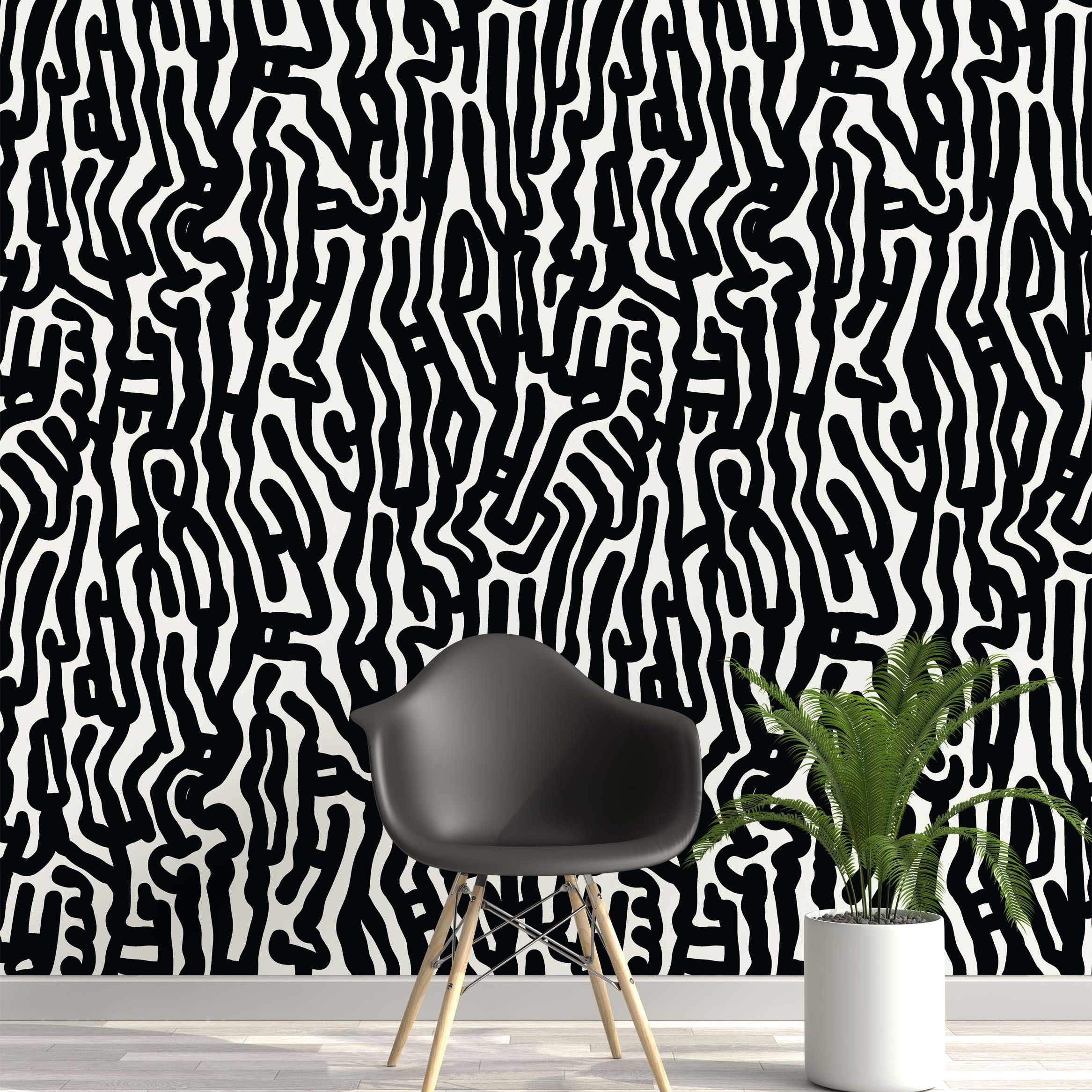 Wallpaper featuring a bold, abstract pattern of thick, meandering black lines on a white background.