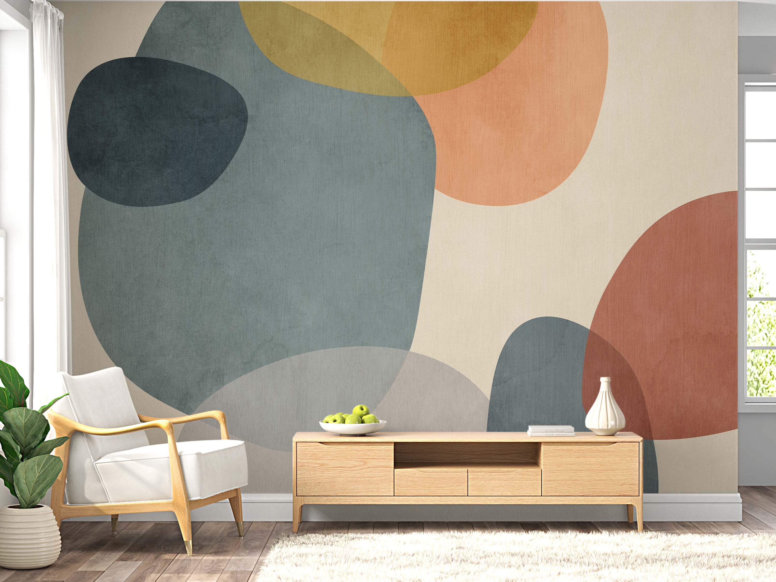 Abstract mural with layered, textured oval forms in teal, peach, yellow, terracotta, and gray on a light beige background.