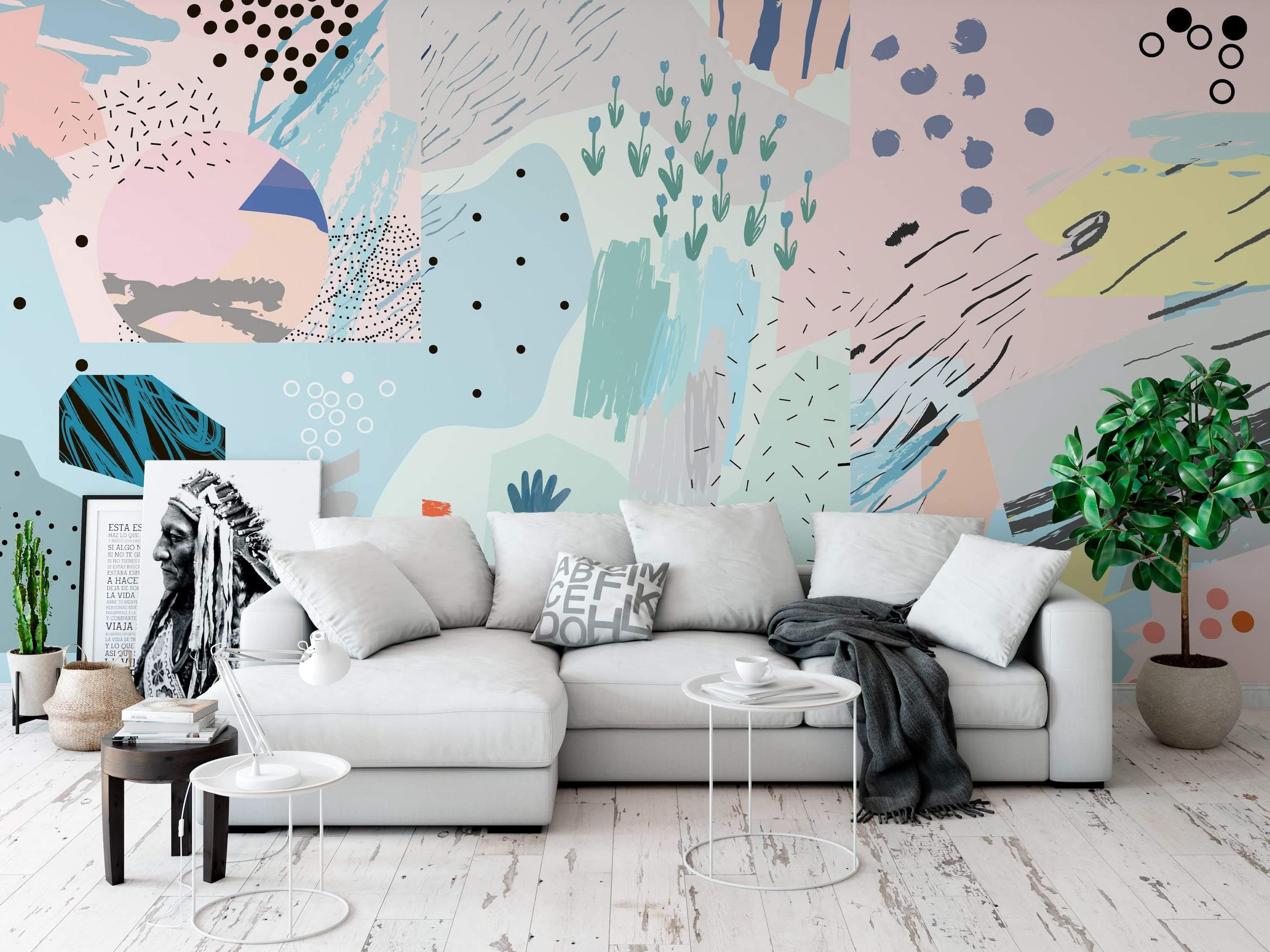 Abstract wall mural featuring pastel pink, blue, mint, and gray shapes with black dots, dashes, brushstrokes, and simple blue flowers.