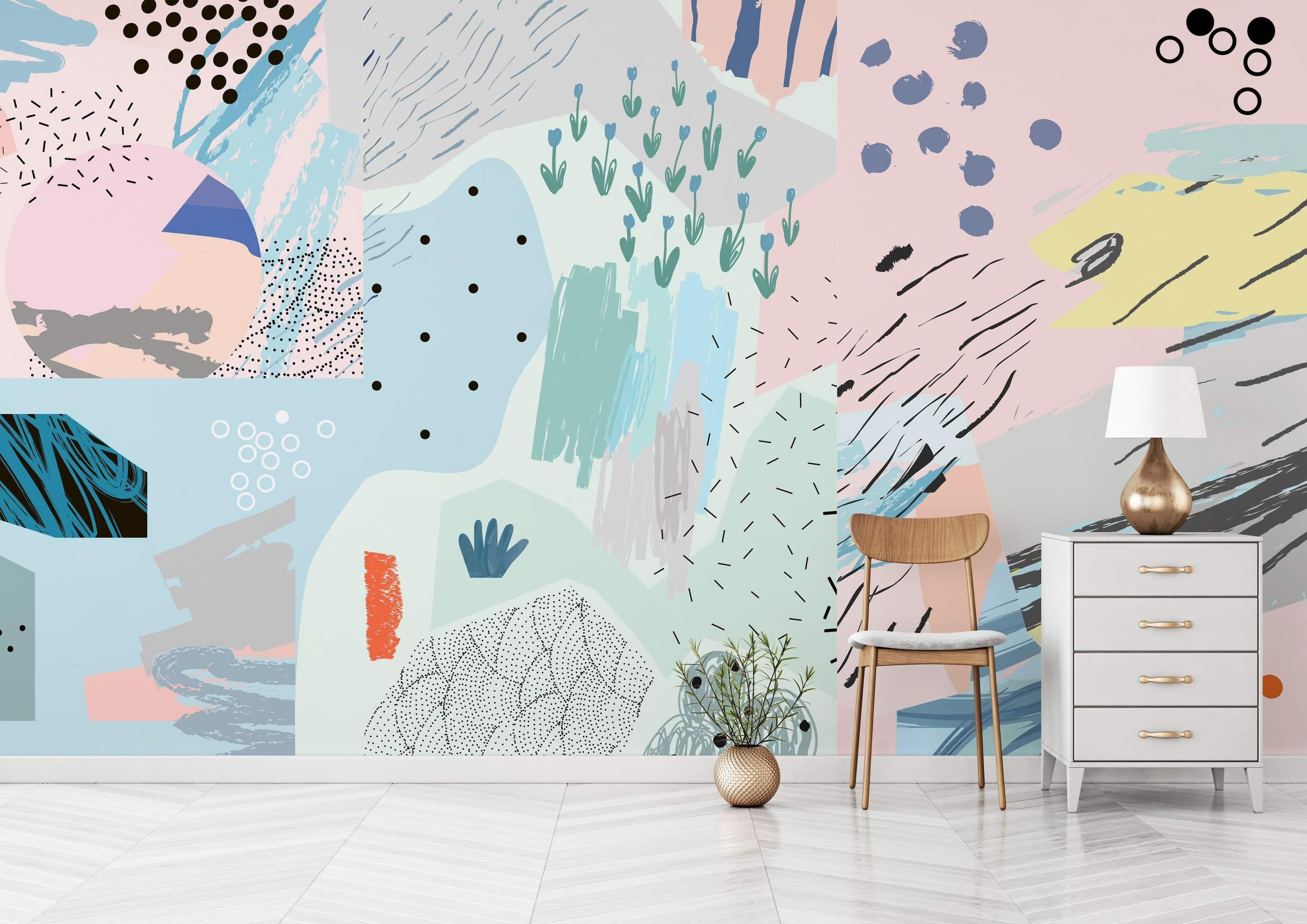 Abstract collage mural featuring pastel pink, blue, green, and yellow shapes with black dots, dashes, scribbles, and floral motifs.