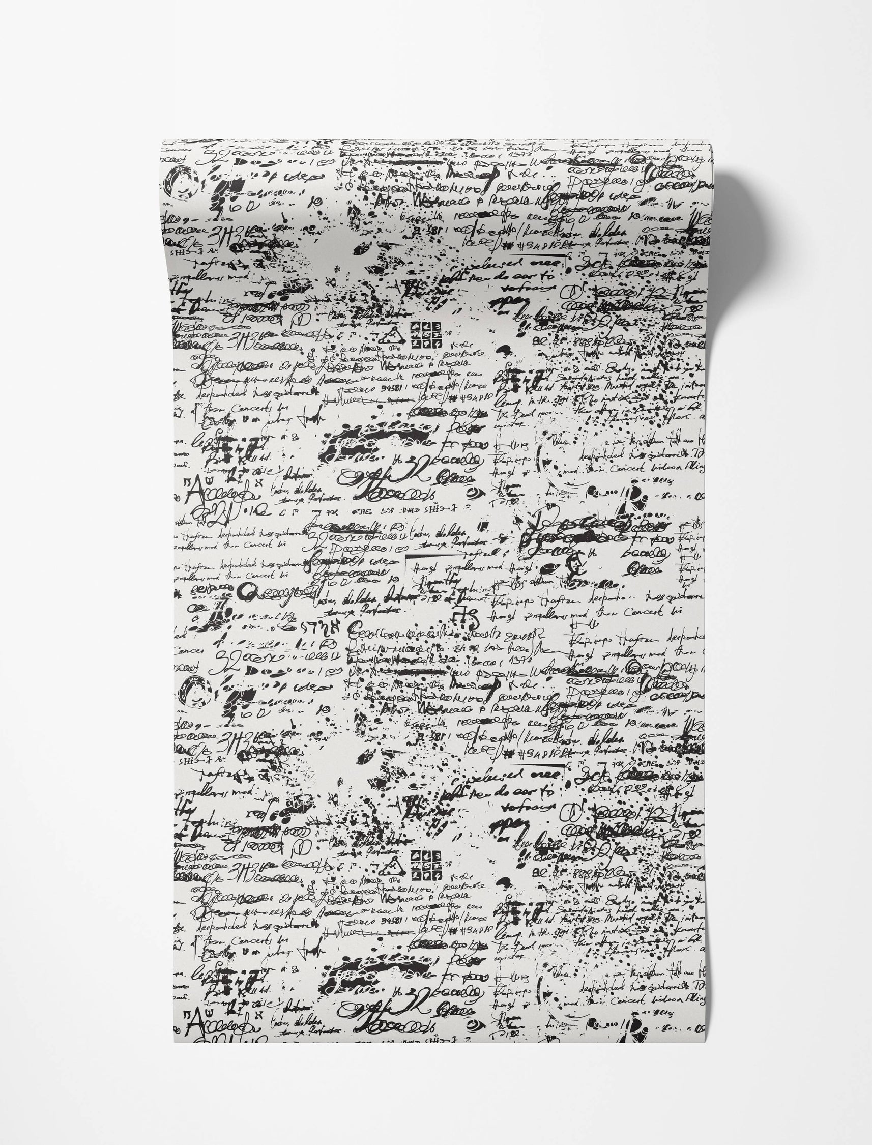 A black and white wallpaper showcasing a repeating design of abstract script, assorted symbols, and ink splatters.