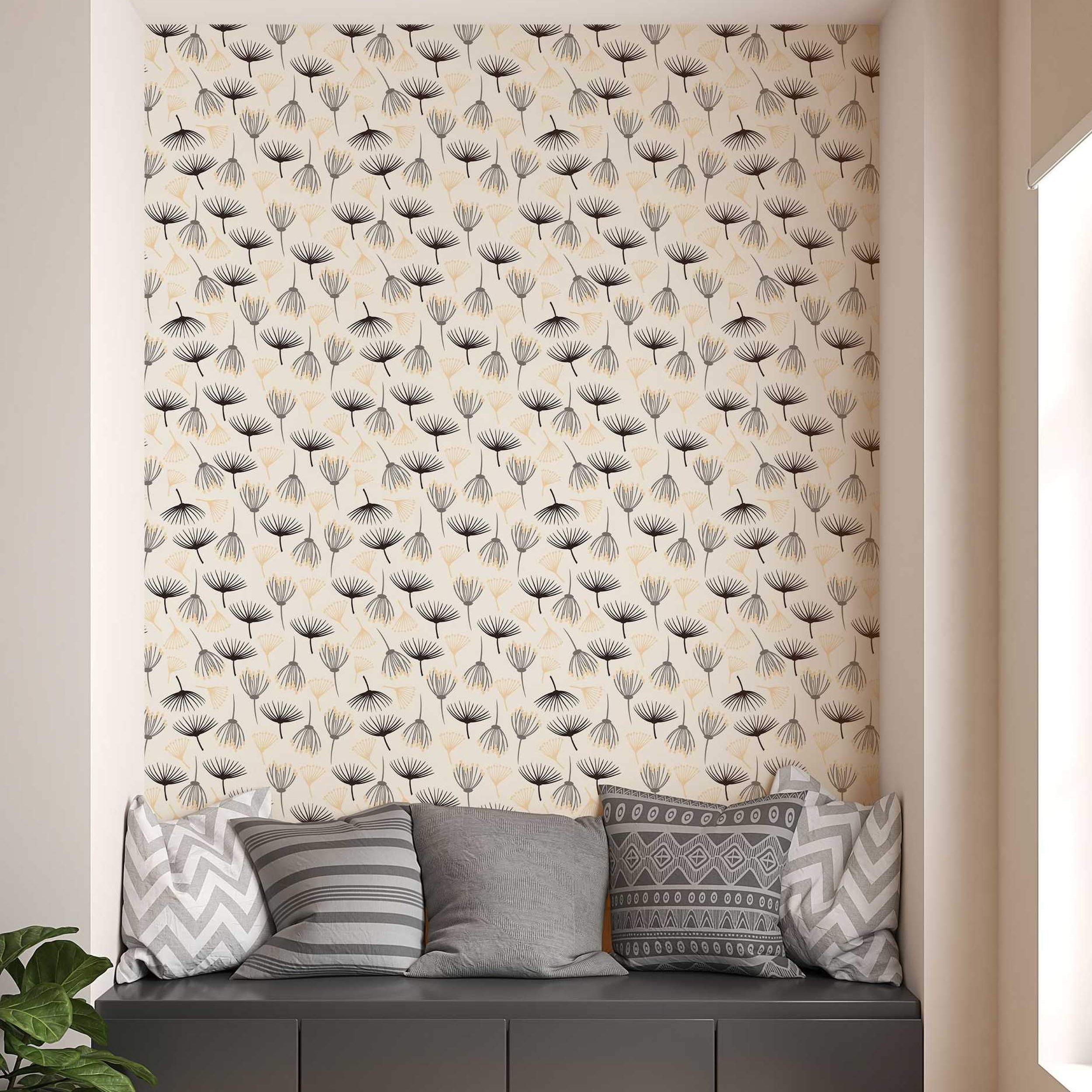 Wallpaper featuring a repeating pattern of stylized black, grey, and pale yellow abstract seed heads on a cream background.