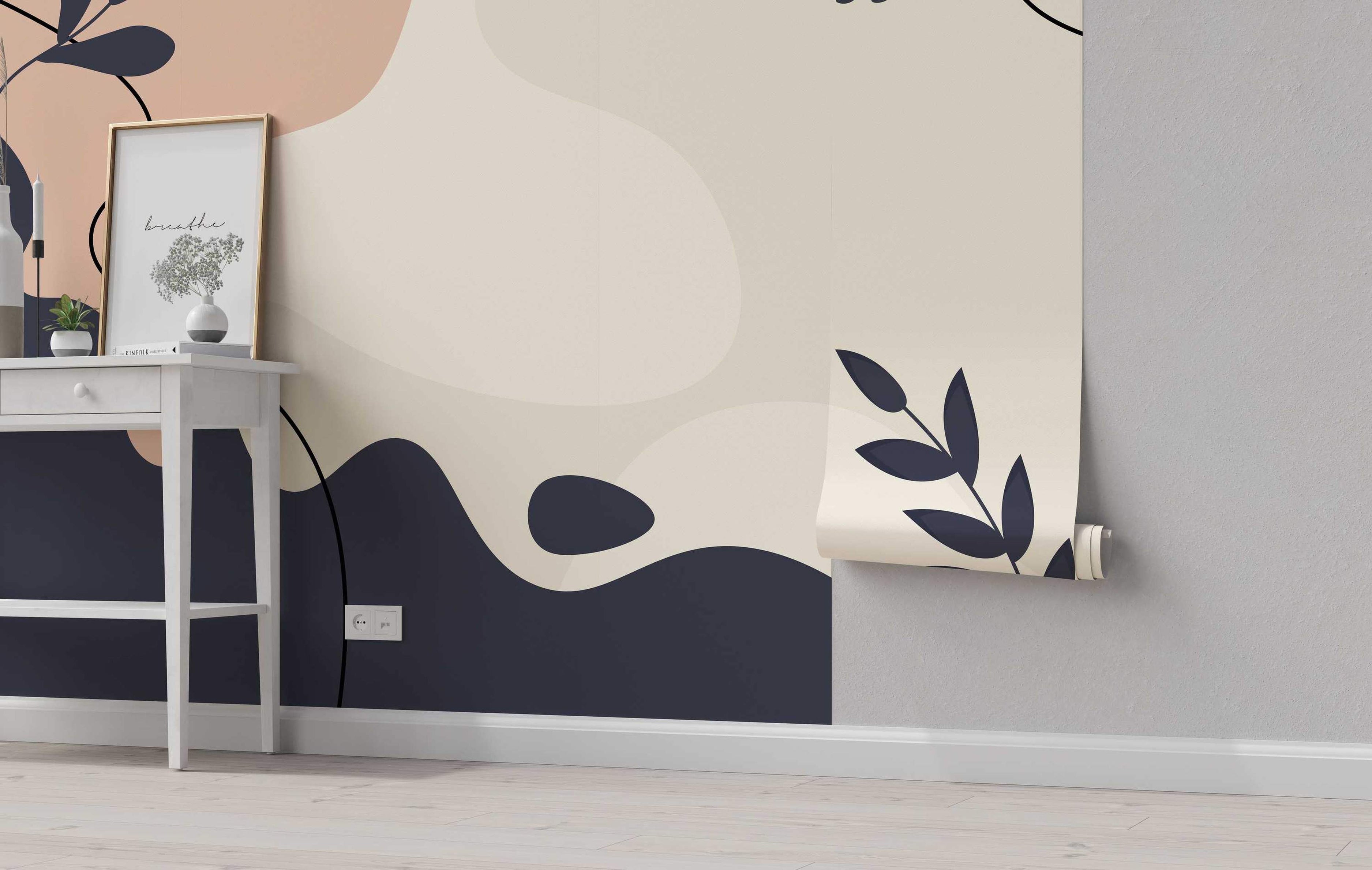 Mural with abstract organic shapes in beige, blush pink, and dark navy. Includes simple leaf motifs and thin black line details.