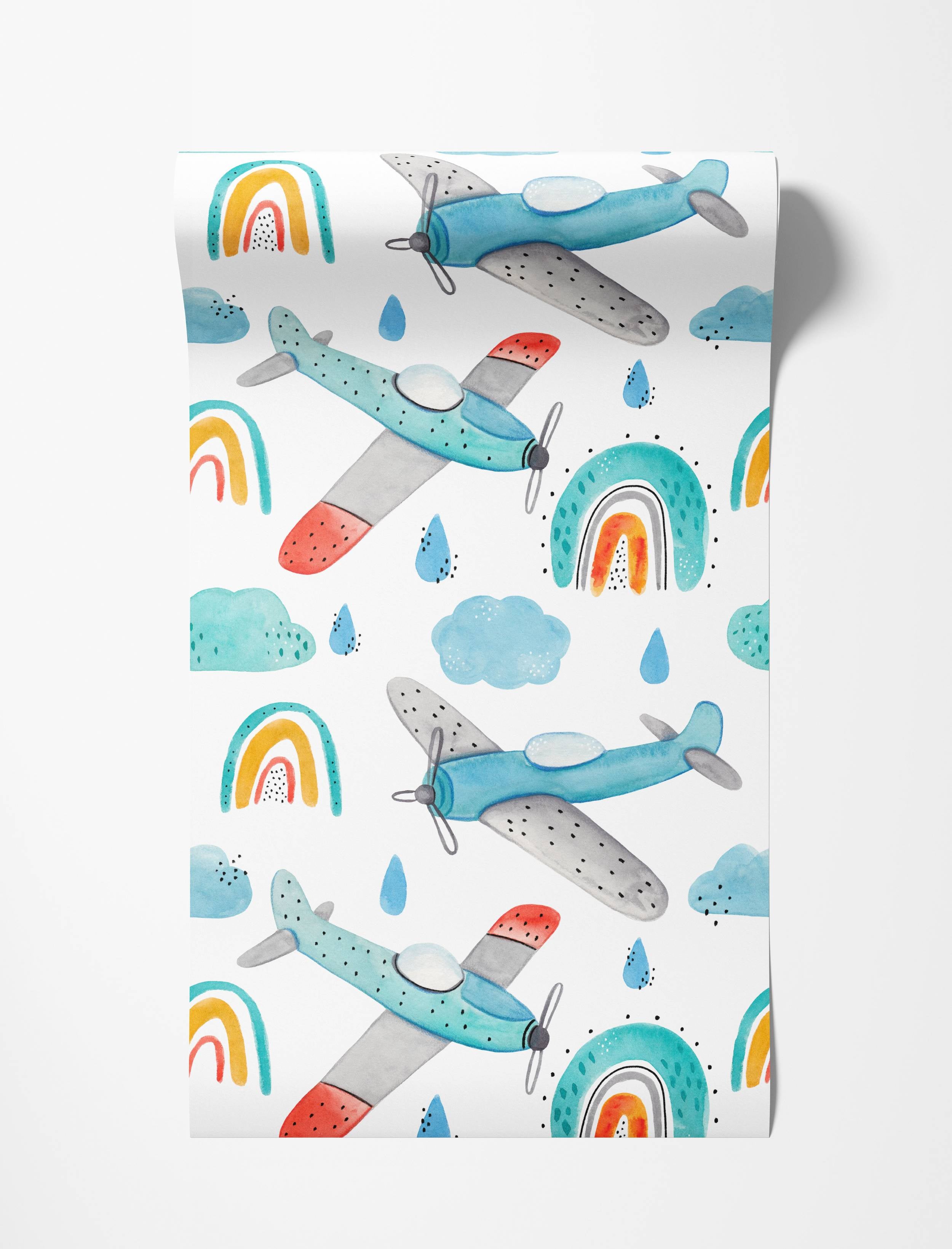Watercolor wallpaper featuring blue and grey airplanes with red accents, teal-yellow-red rainbows, blue clouds, and raindrops.