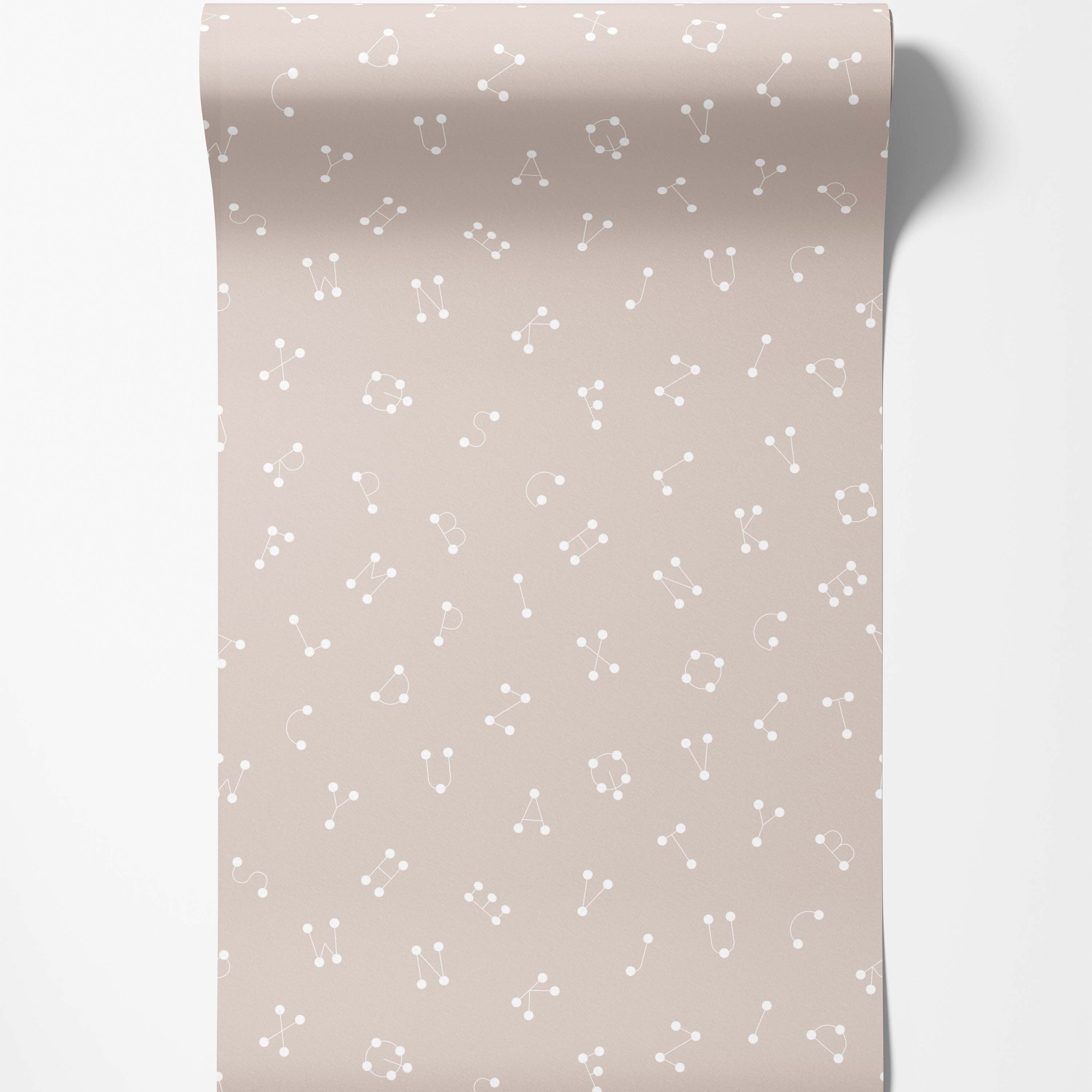 Wallpaper with a repeating pattern of stylized alphabet letters as white constellations on a soft beige background.