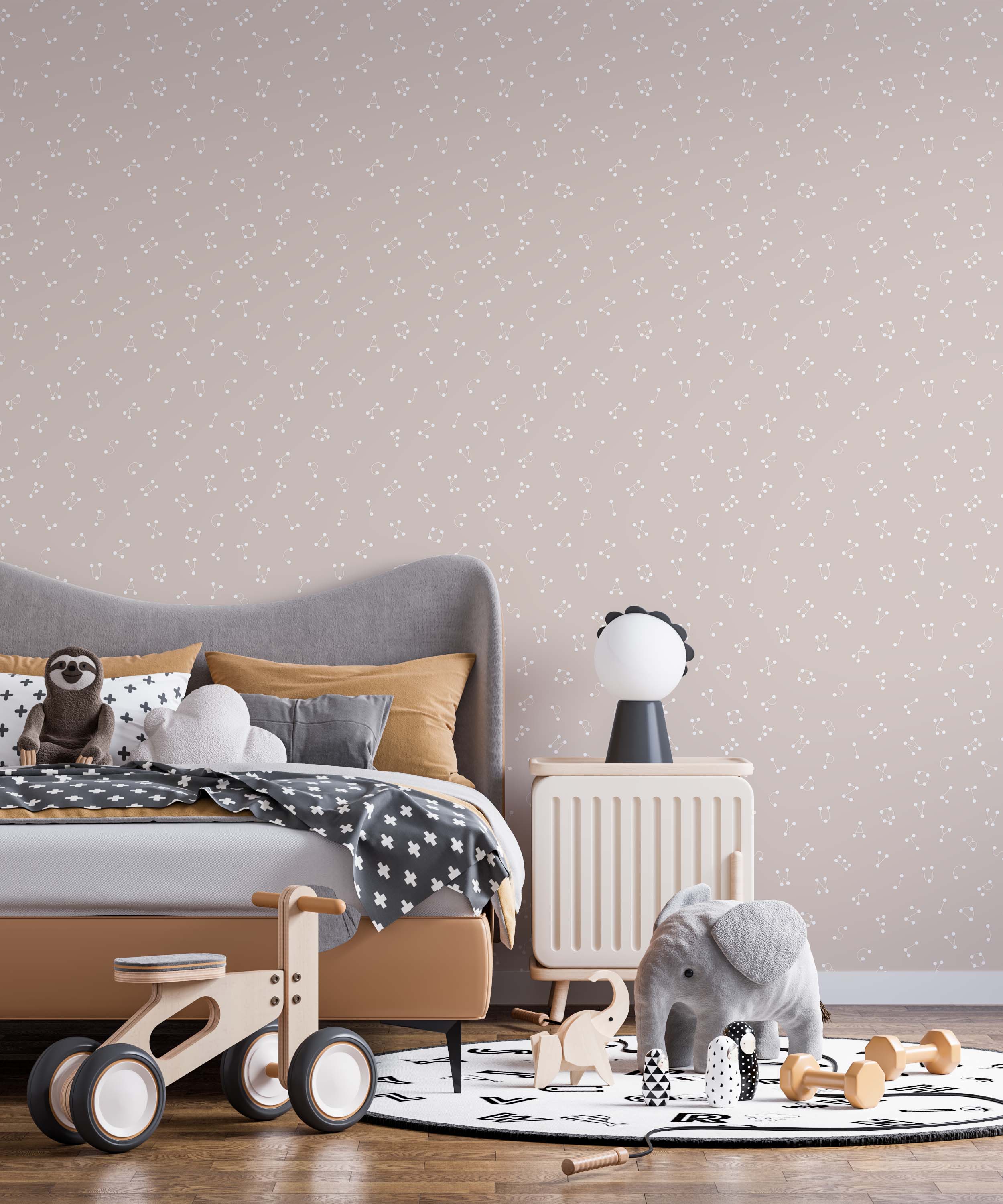 A playful wallpaper with alphabet letters designed as constellations in off-white on a dusty pink background.