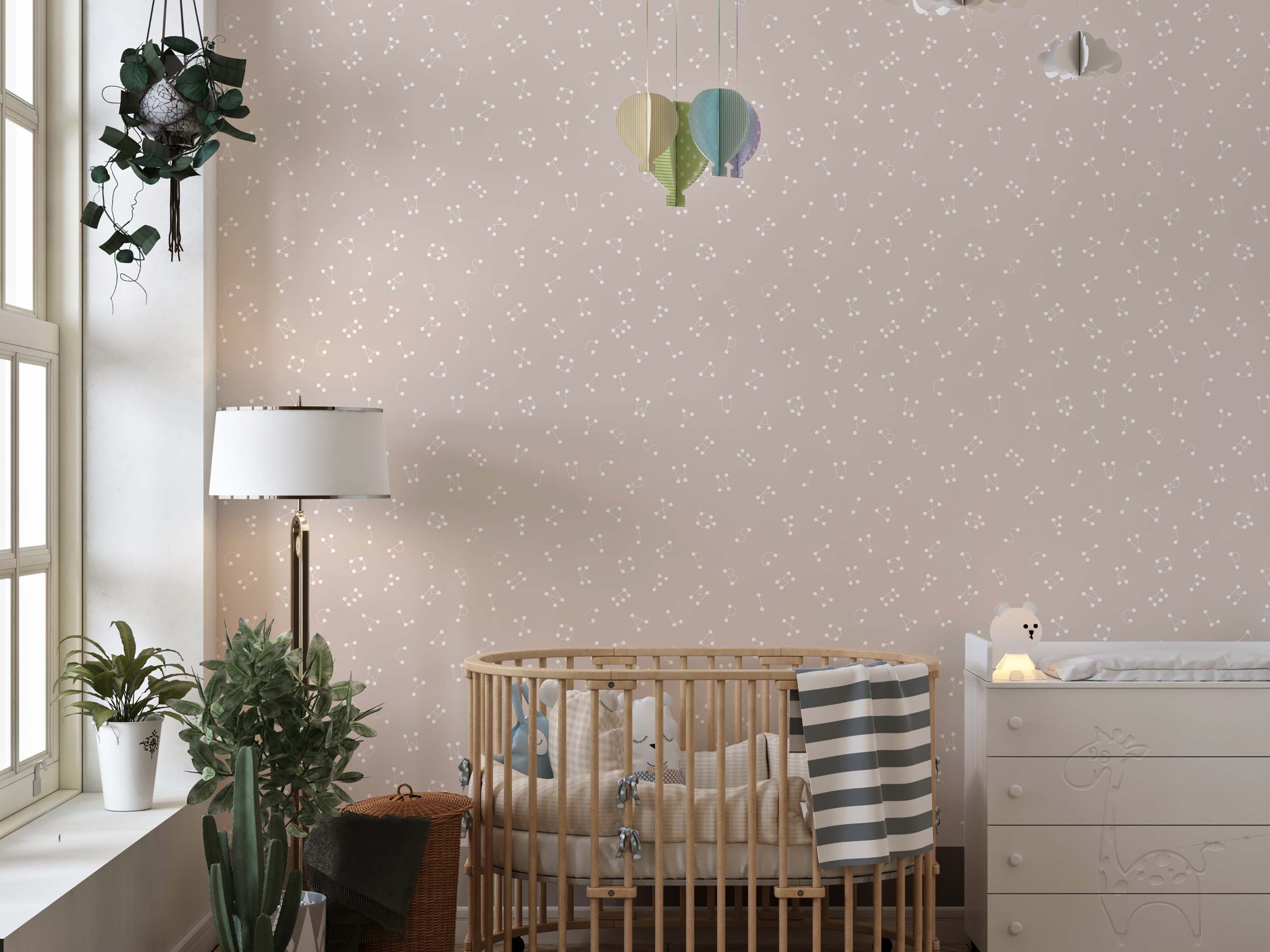 A playful alphabet wallpaper featuring letters as white dot constellations on a soft, dusty pink background.
