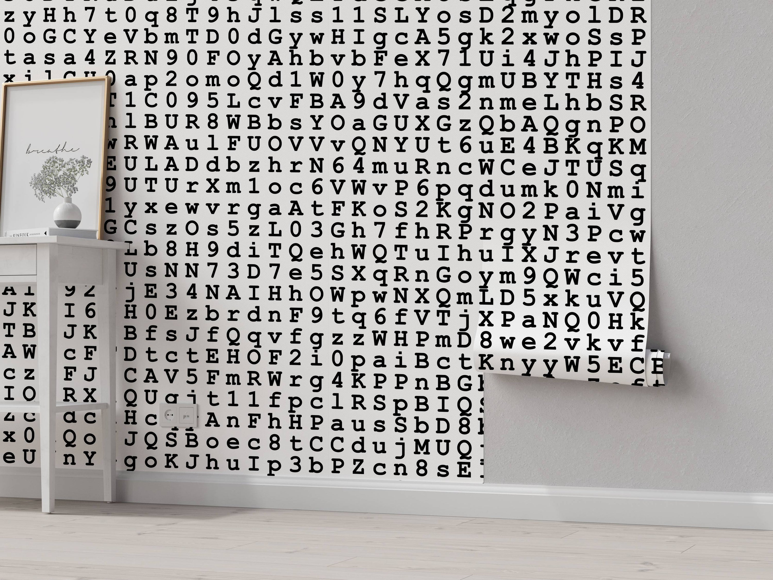 Wallpaper with a repeating pattern of black typewriter-style letters and numbers on a white background.