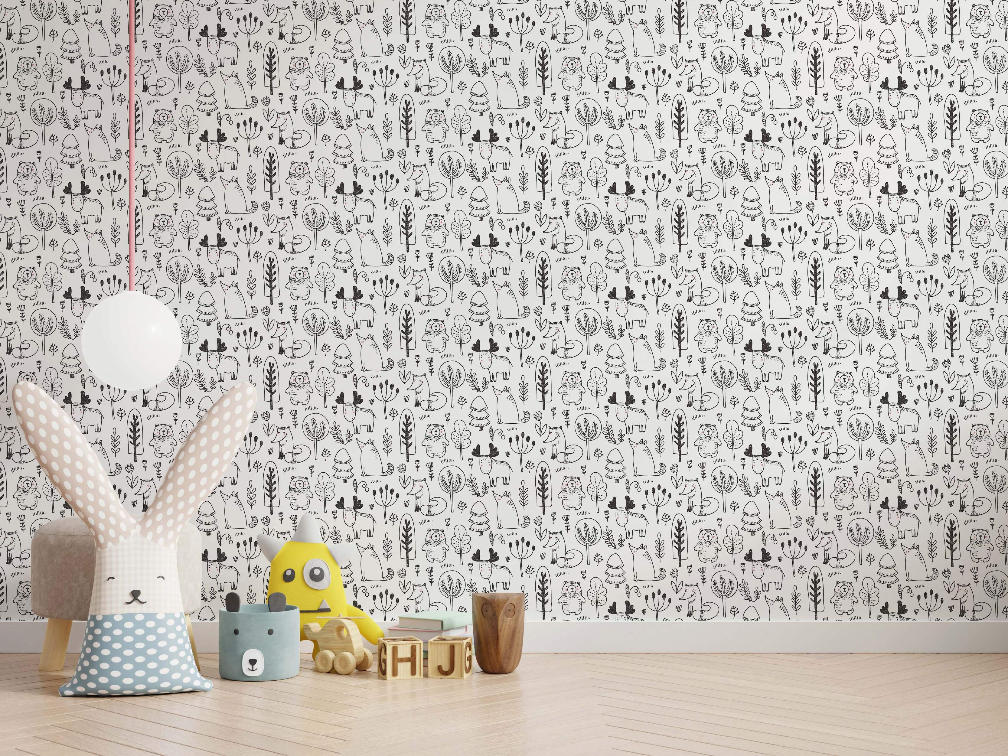Whimsical black and white wallpaper featuring hand-drawn woodland animals like bears, foxes, and moose among trees and foliage.