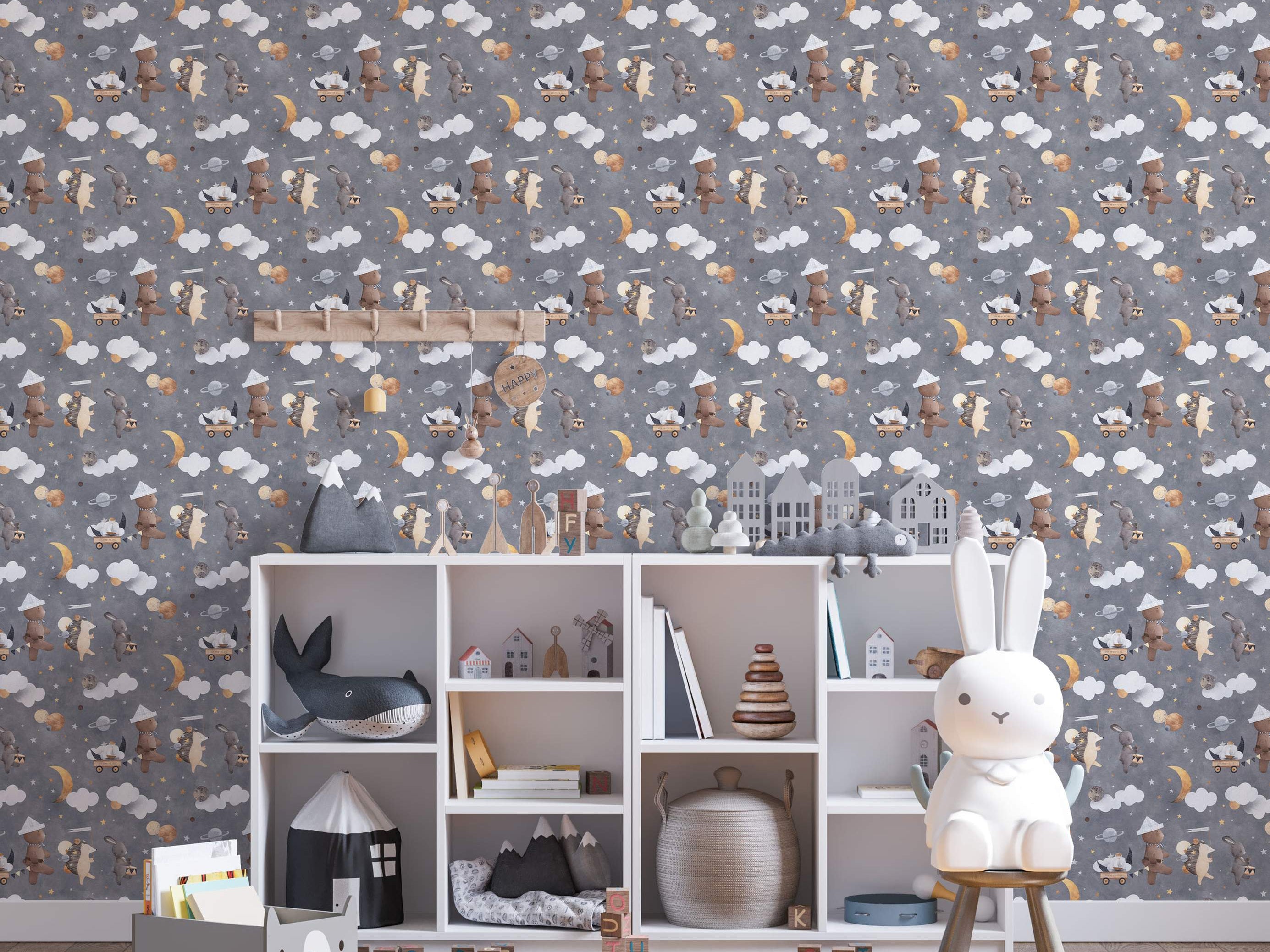 Kids wallpaper with repeating pattern of illustrated bears, rabbits, and hedgehogs amongst clouds, stars, moons, and planets on gray.