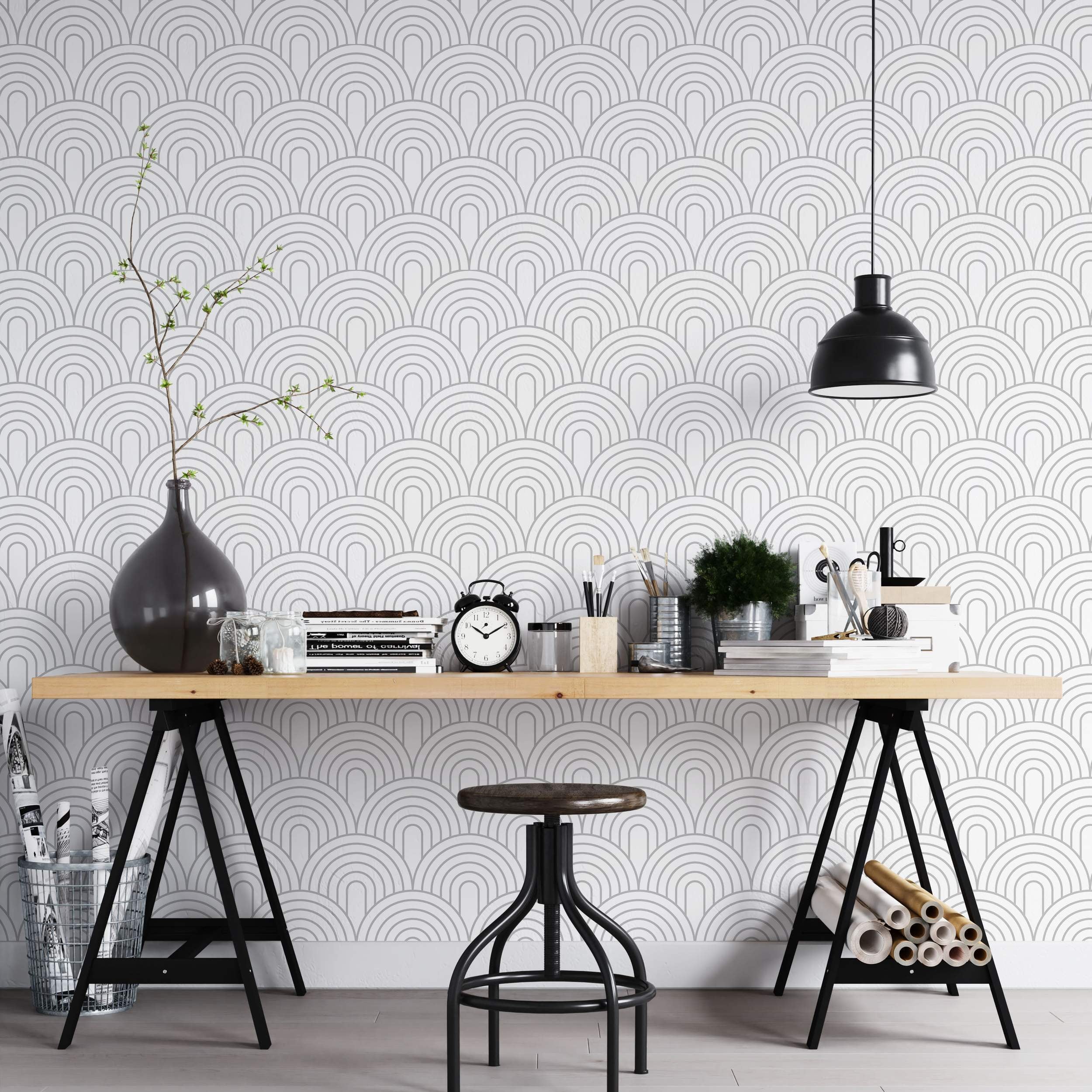 Geometric wallpaper with repeating gray concentric arch patterns stacked on a white background.