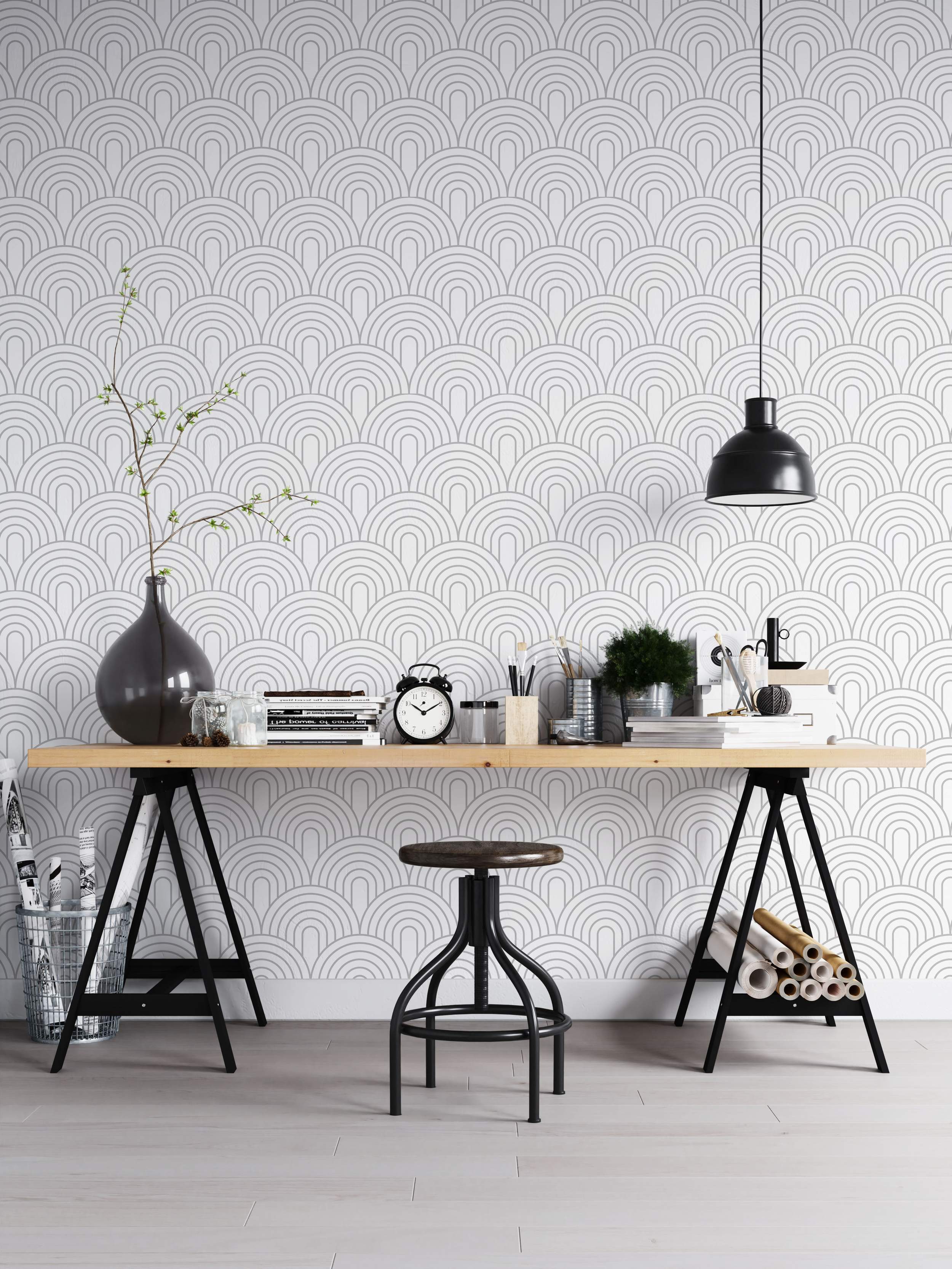 Geometric wallpaper with repeating gray concentric arch patterns stacked on a white background.