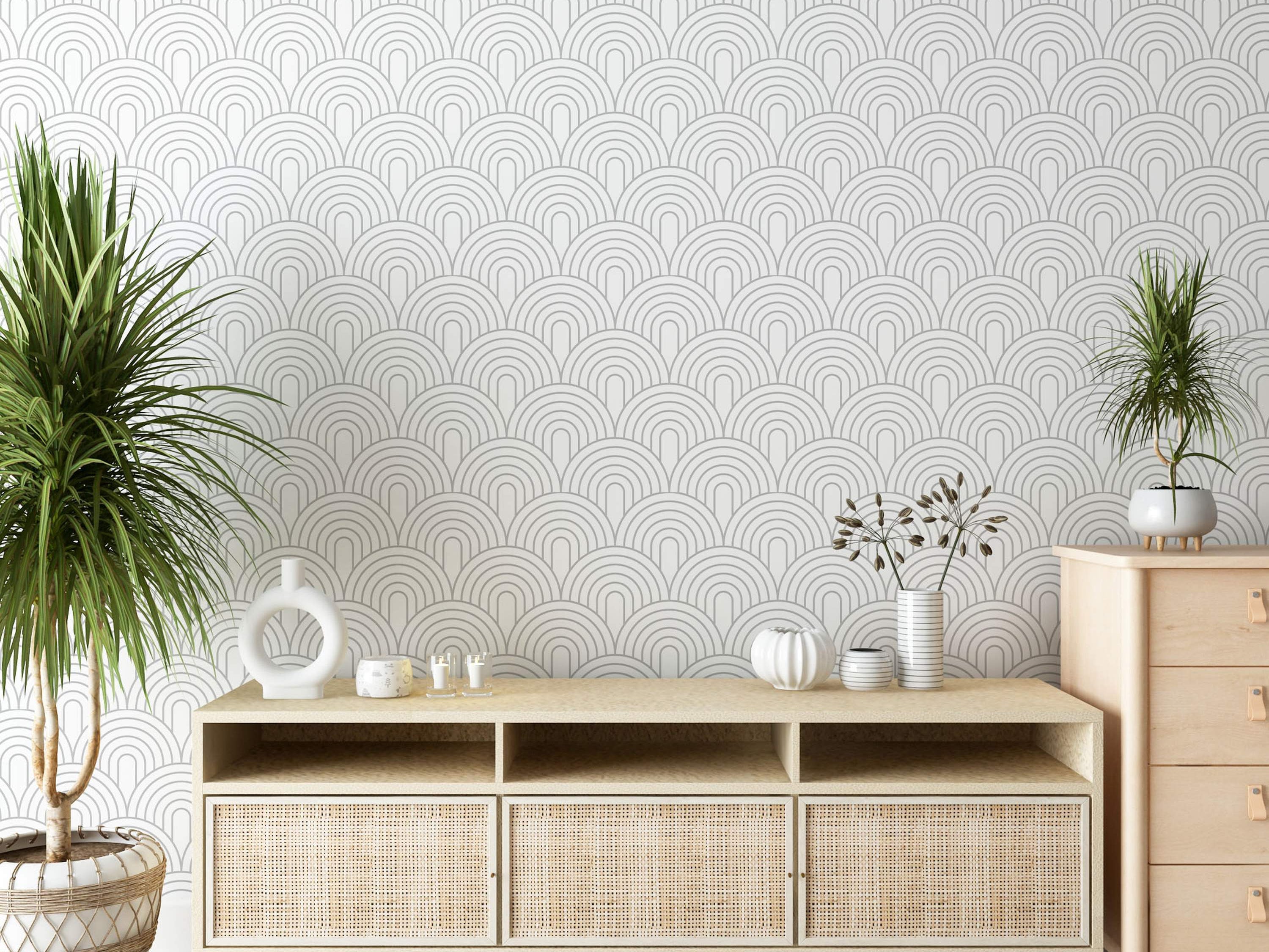 Geometric wallpaper with a repeating pattern of nested grey arches outlined on a clean white background.