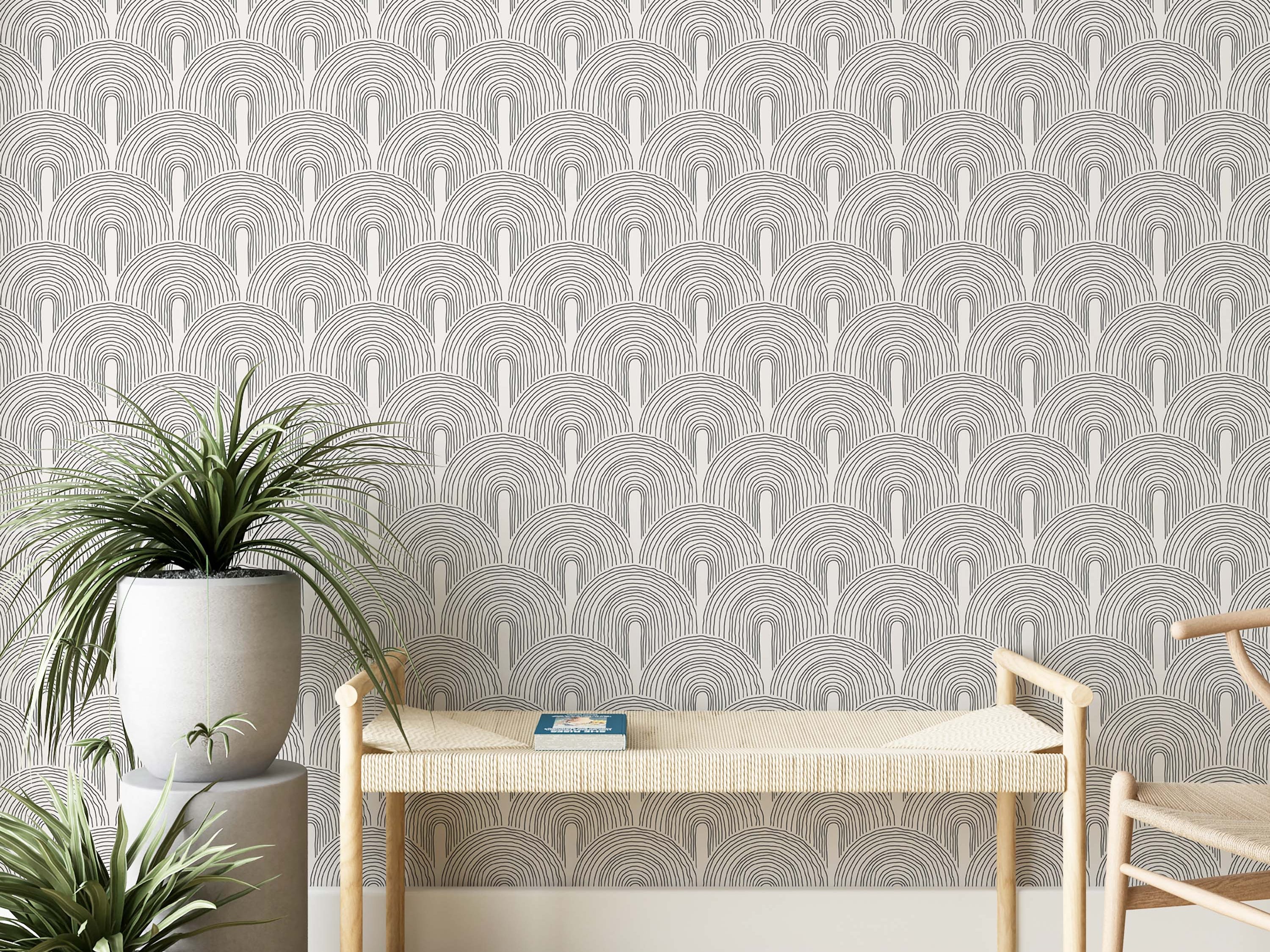 Wallpaper featuring repeating hand-drawn black line art arches creating a geometric pattern on a white background.