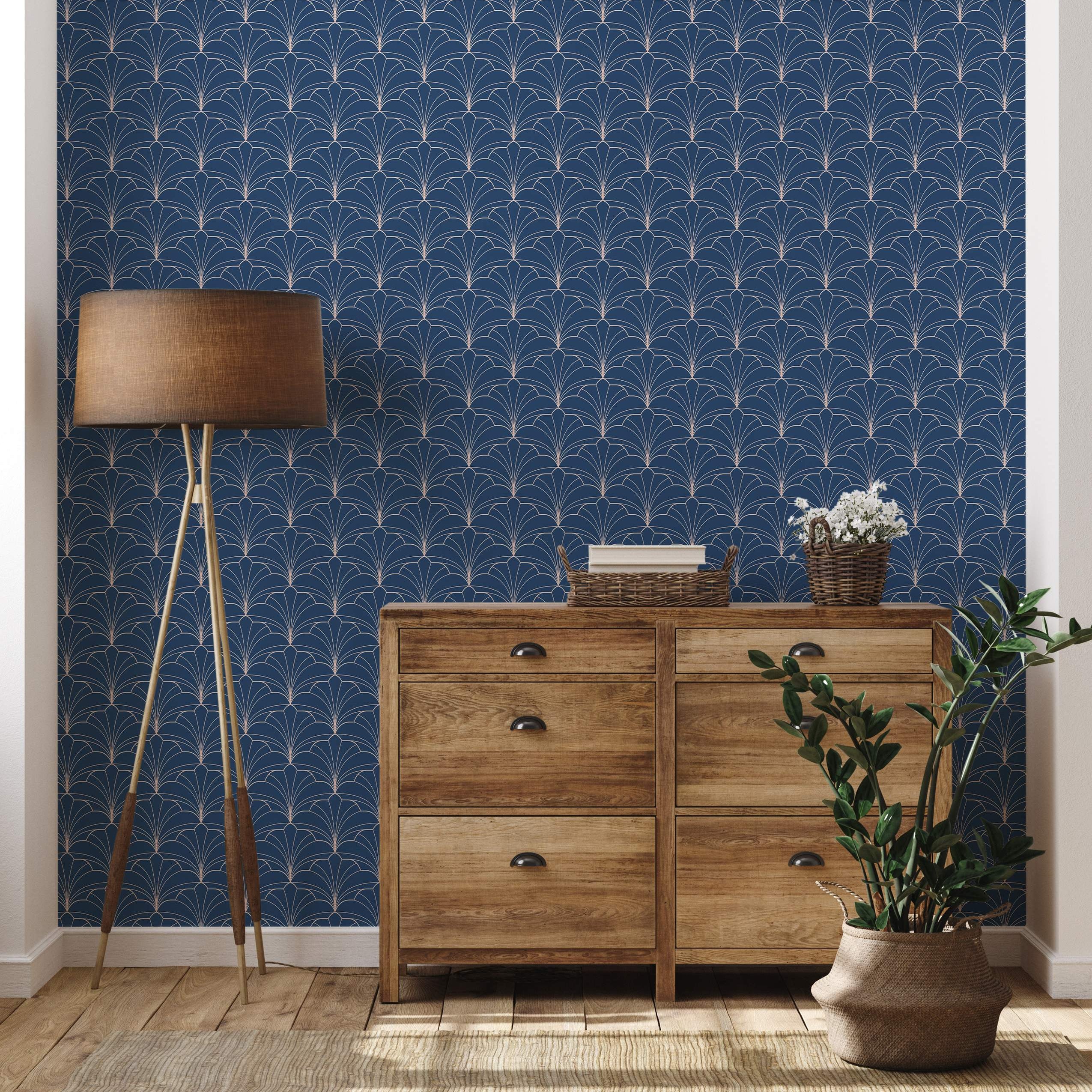 Art Deco style wallpaper with repeating geometric fan shapes outlined in thin gold lines on a dark navy blue background.