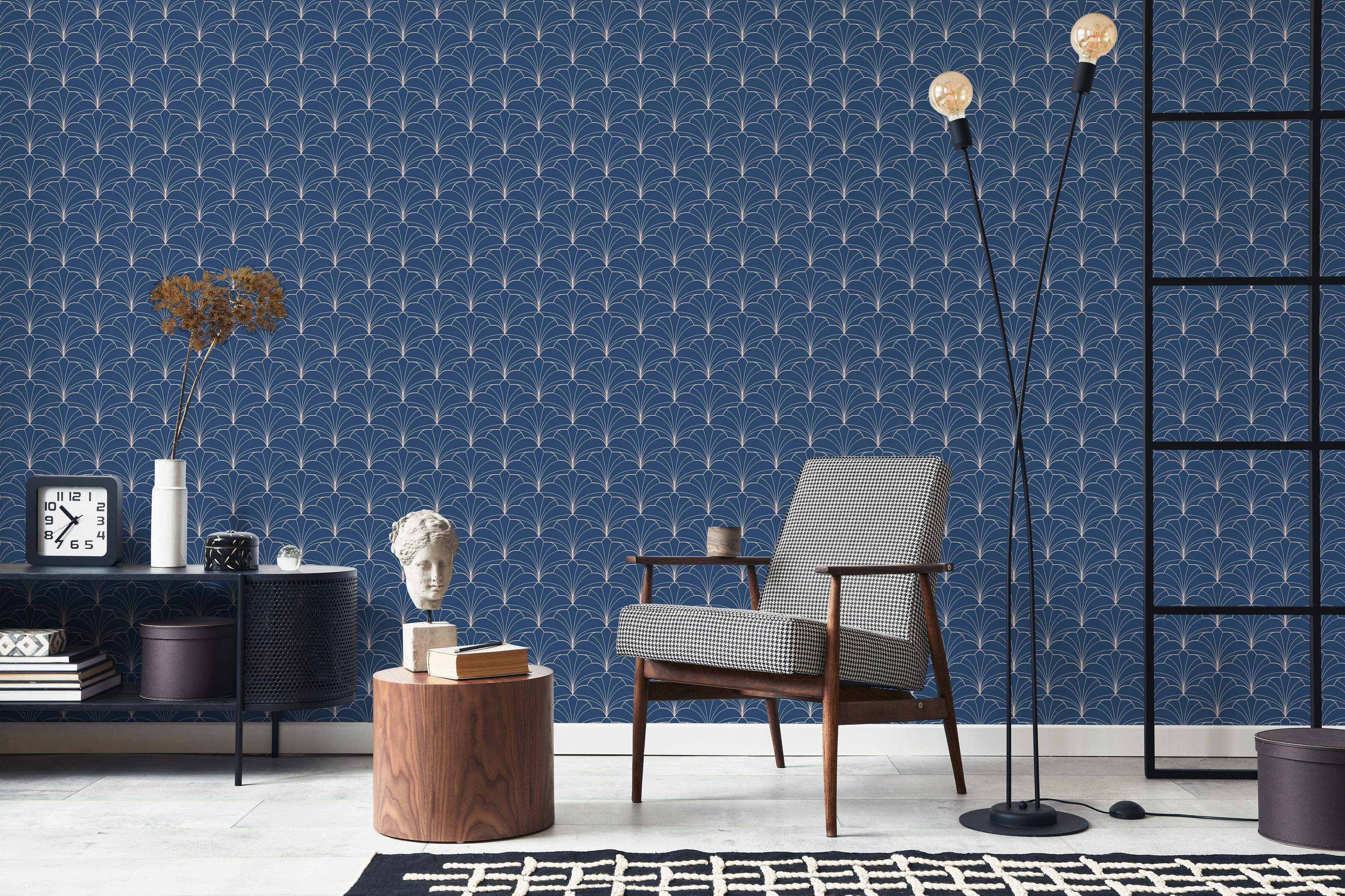 Art Deco style wallpaper featuring a repeating geometric fan pattern in thin beige lines on a dark blue background.