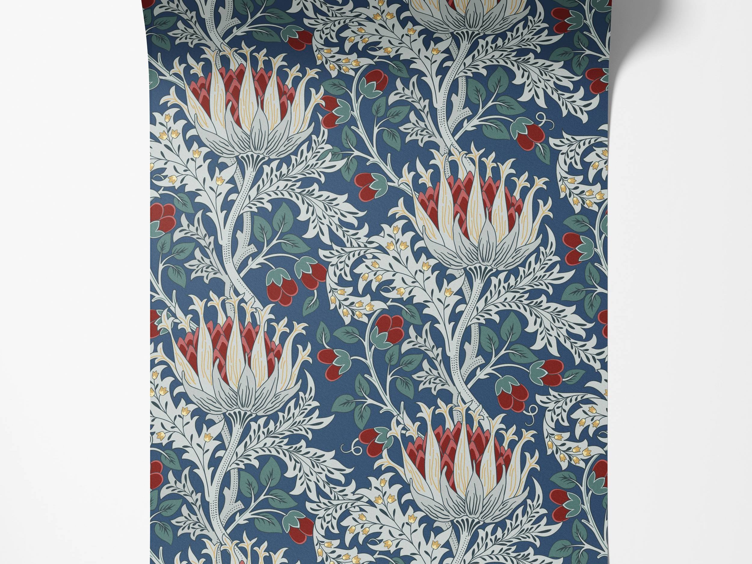 Arts and Crafts style wallpaper with a floral pattern of large red and white flowers, berries, and foliage on a blue background.