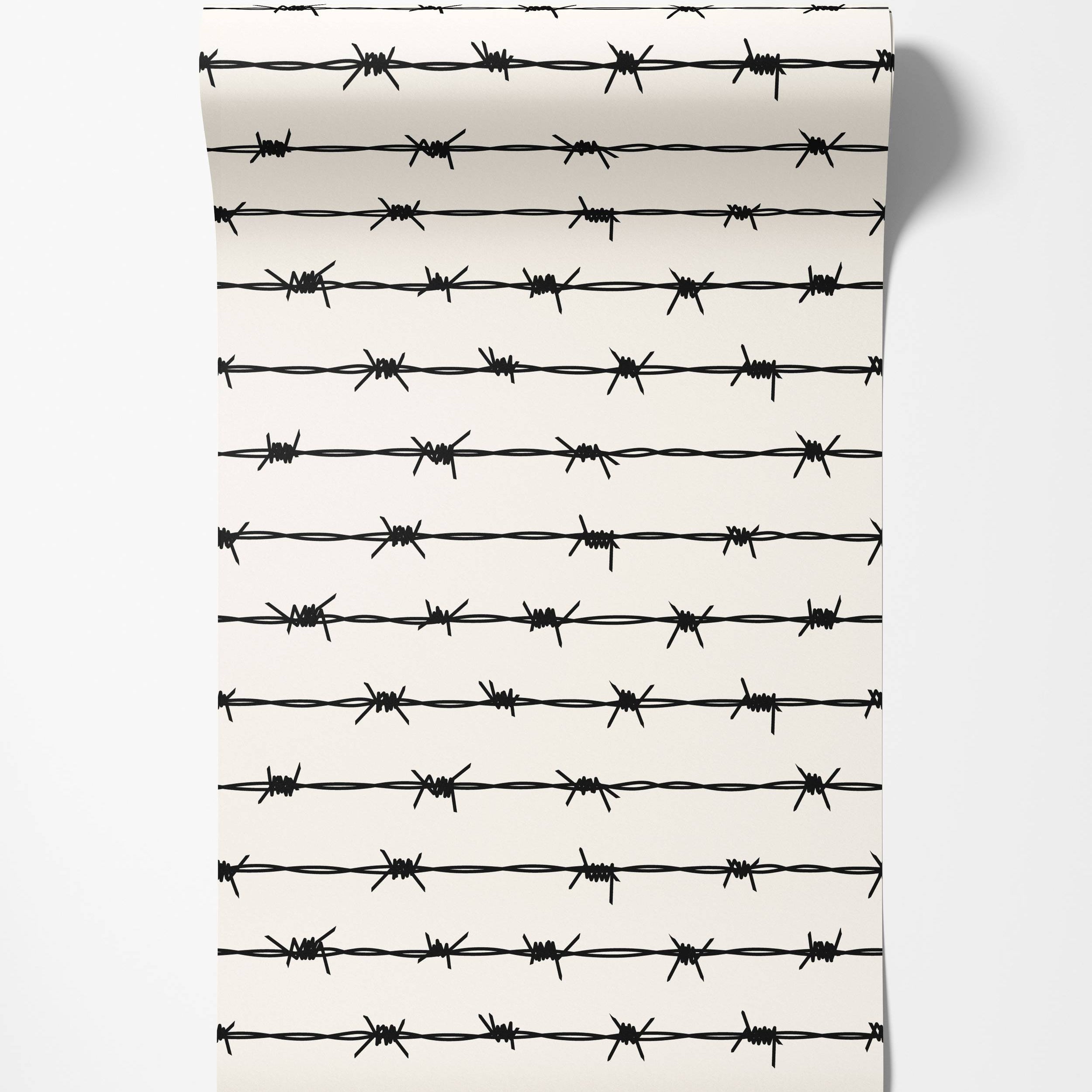 Wallpaper featuring a repeating pattern of black barbed wire strands on an off-white background.