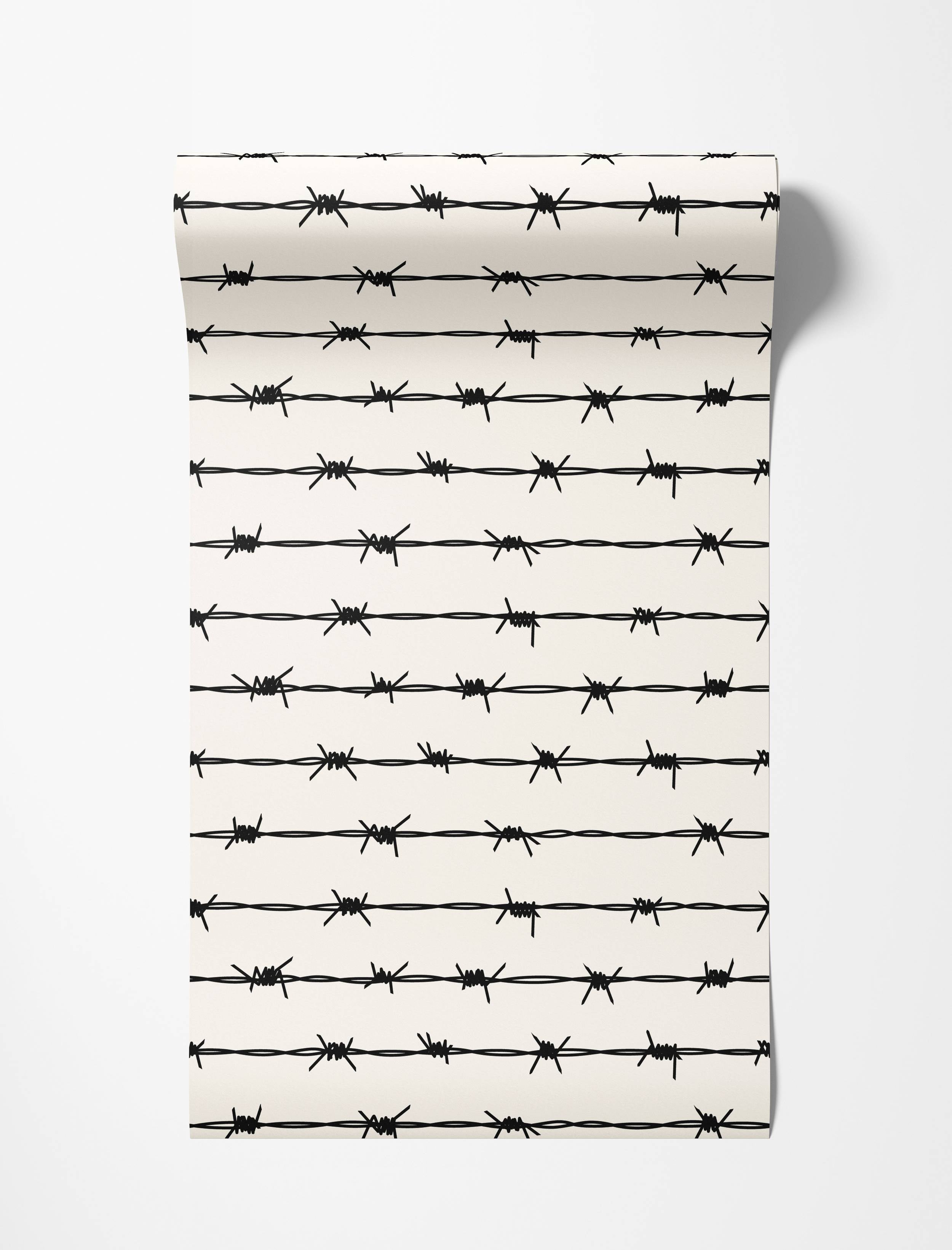 Wallpaper featuring a repeating pattern of black barbed wire strands on an off-white background.