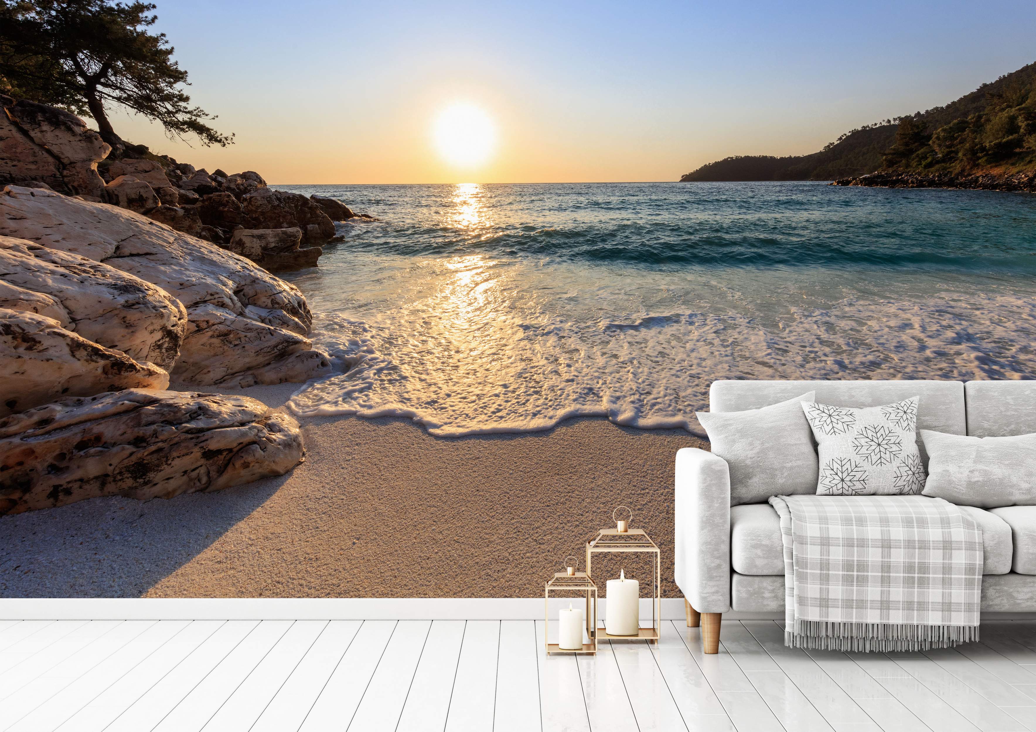 Photorealistic mural of a rocky beach cove at sunset, showing the golden sun reflecting on the blue water and sandy shore.