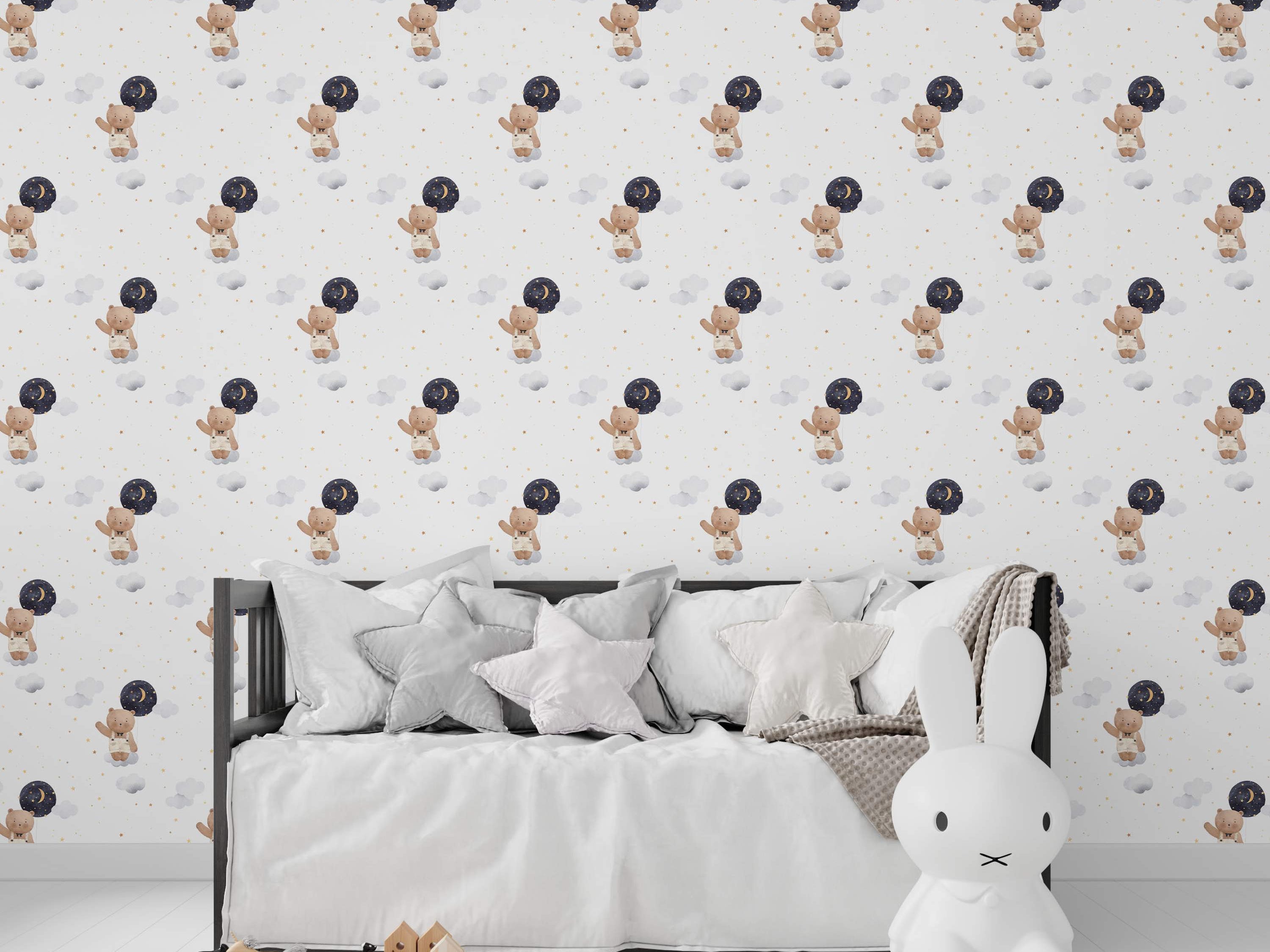 Wallpaper featuring watercolor teddy bears holding night sky balloons, floating among grey clouds and gold stars on a light background.