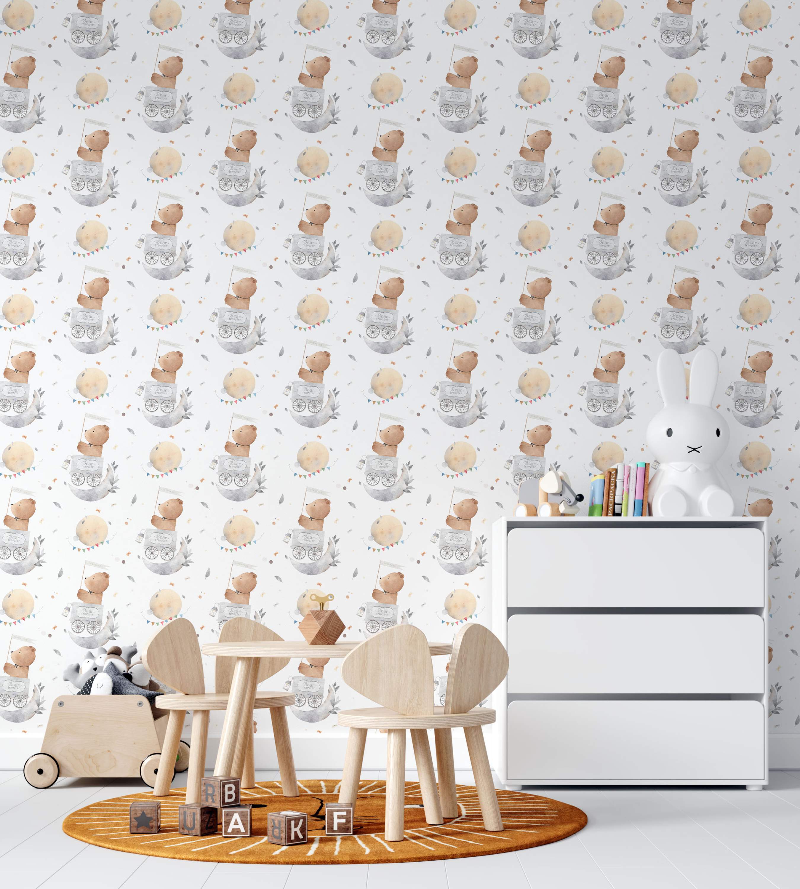 Watercolor wallpaper featuring a repeating pattern of brown teddy bears in gray moon carriages, yellow moons with bunting, and gray leaves on a white background.