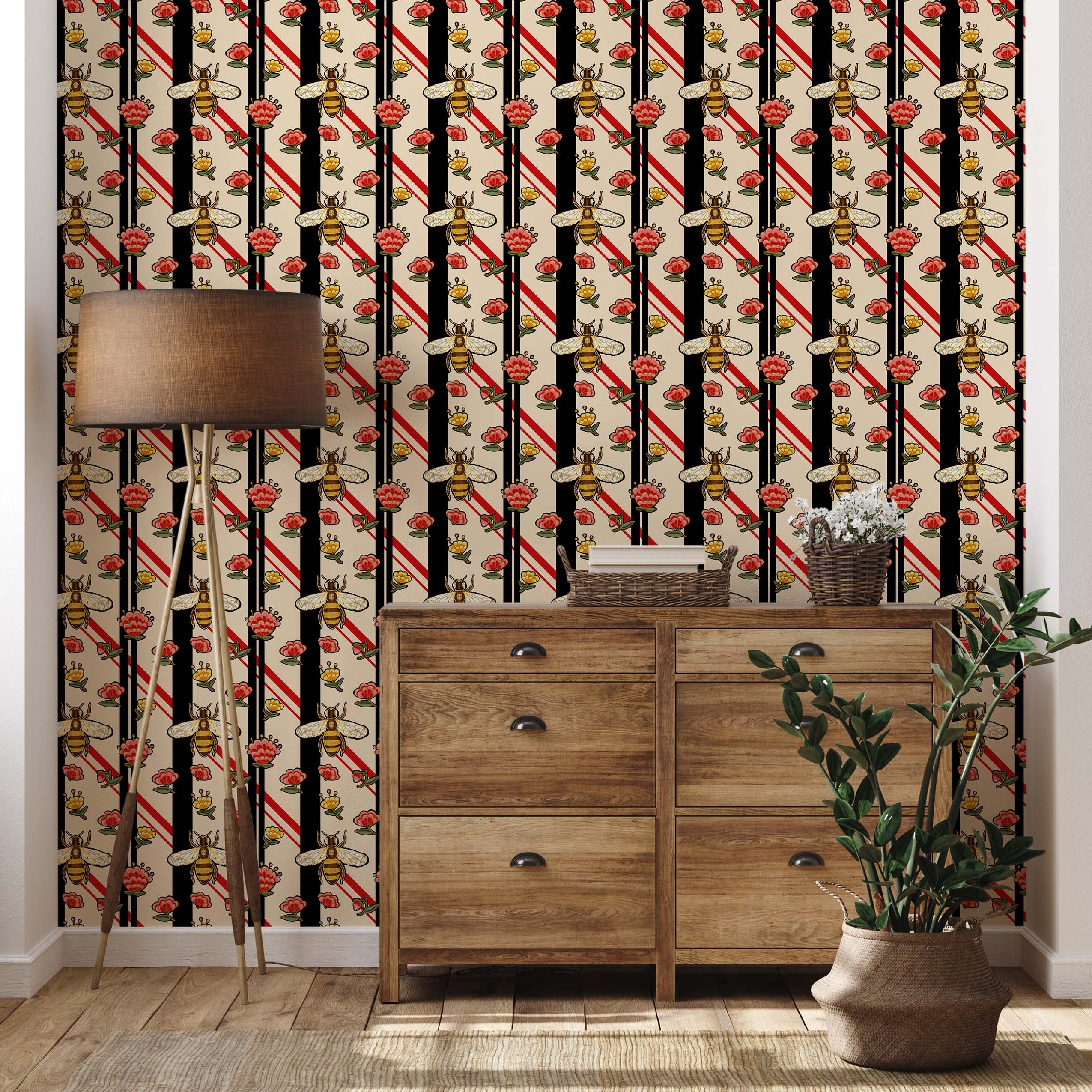 A stylized wallpaper with bees and flowers set against vertical black stripes and diagonal red stripes on a cream background.