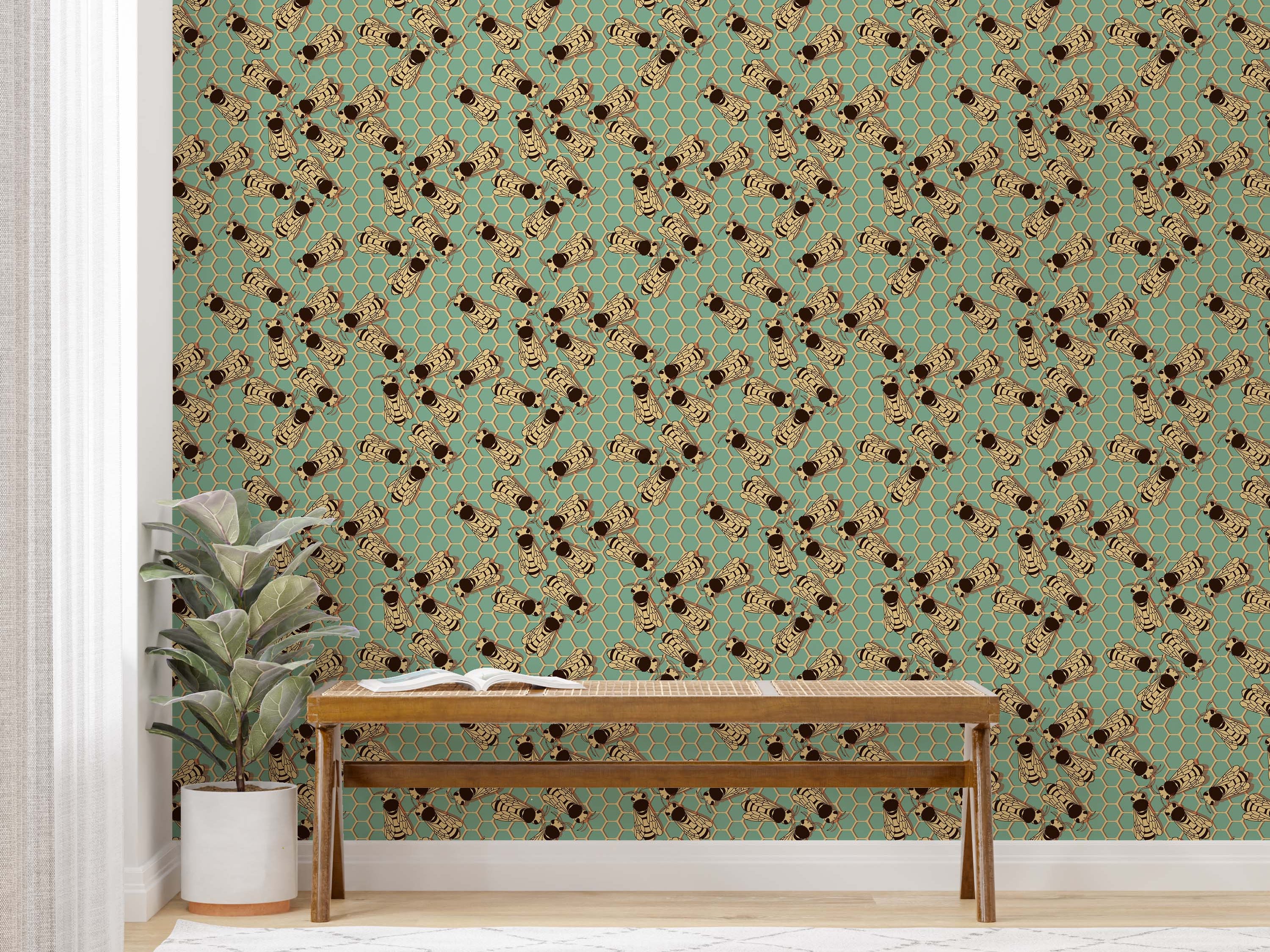 Wallpaper with a repeating pattern of illustrated bees in black and tan over a teal background with a honeycomb design.