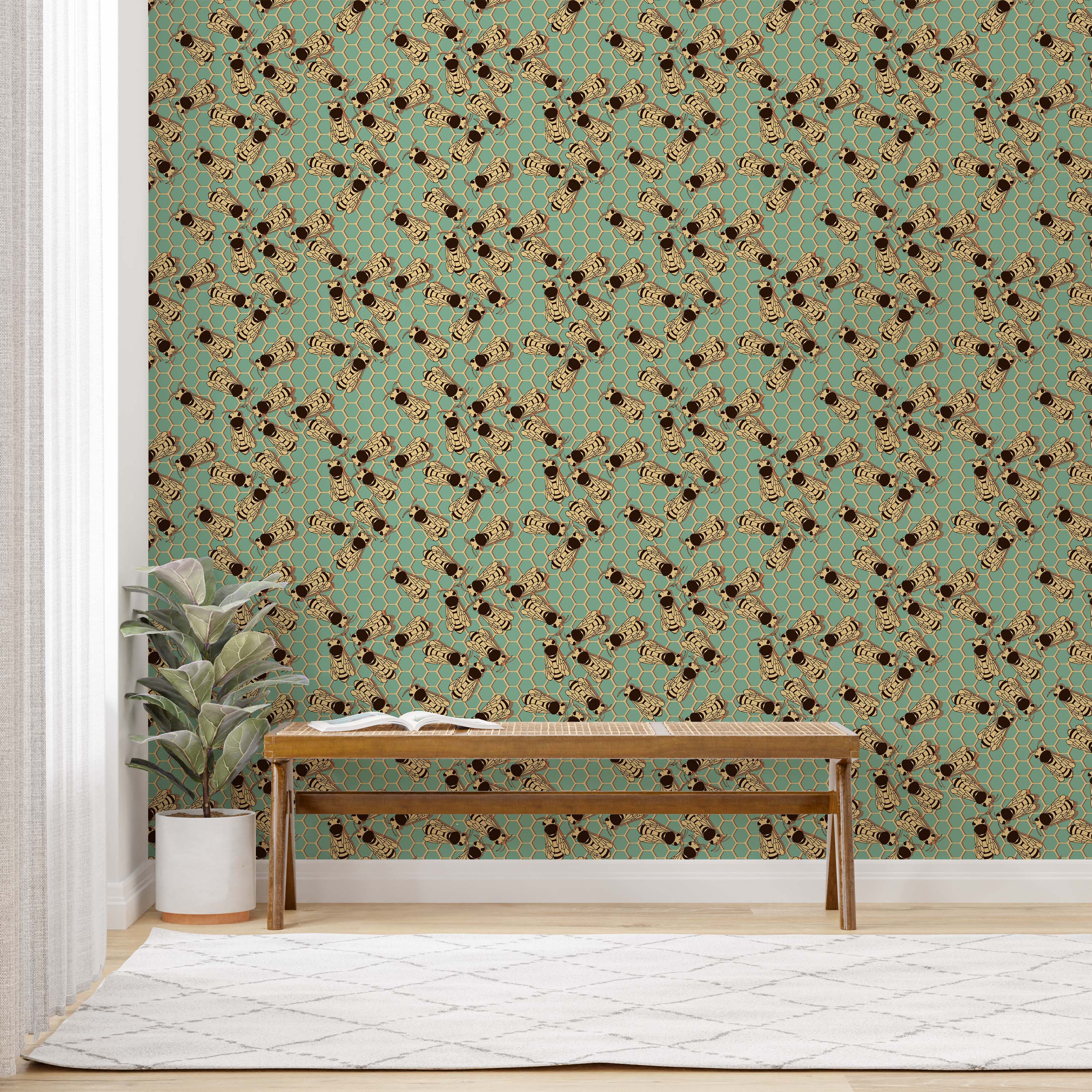 Wallpaper with a repeating pattern of illustrated bees in black and tan over a teal background with a honeycomb design.