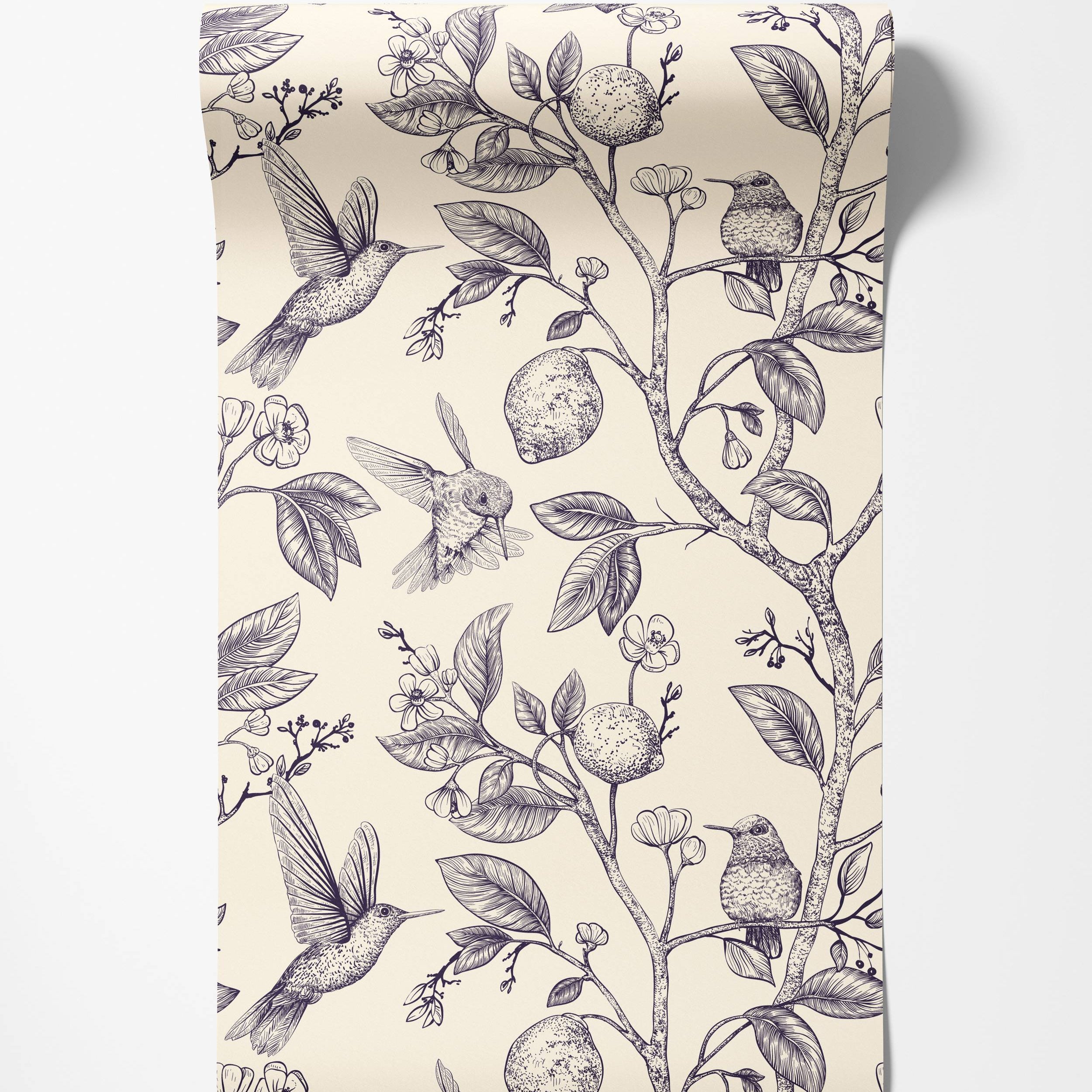 A vintage-style wallpaper featuring detailed navy line drawings of hummingbirds, lemons, and flowers on a cream background.