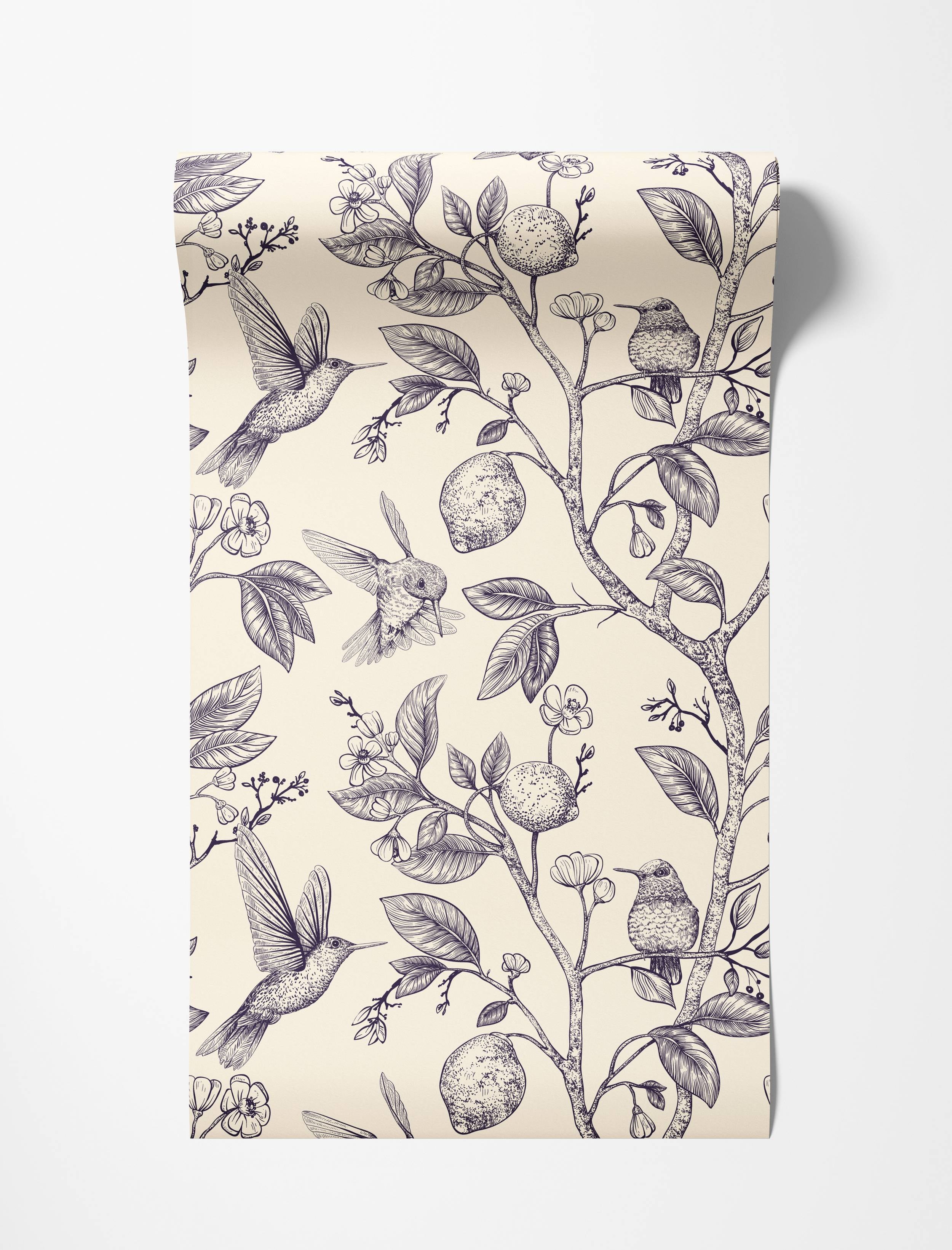 A vintage-style wallpaper featuring detailed navy line drawings of hummingbirds, lemons, and flowers on a cream background.