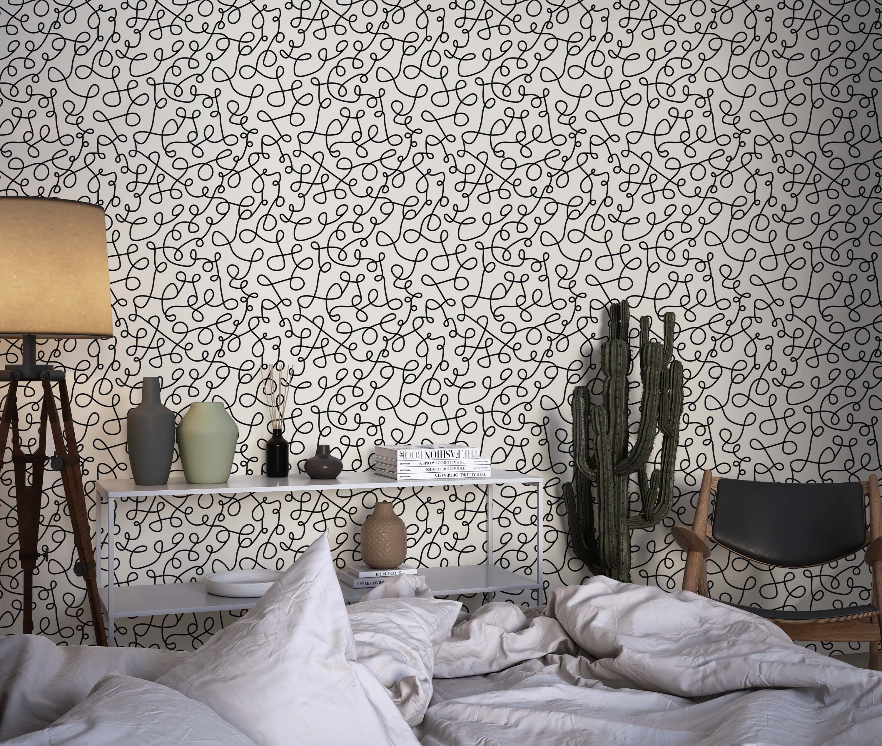 Wallpaper featuring a pattern of continuous black squiggly lines forming interlocking loops on an off-white background.