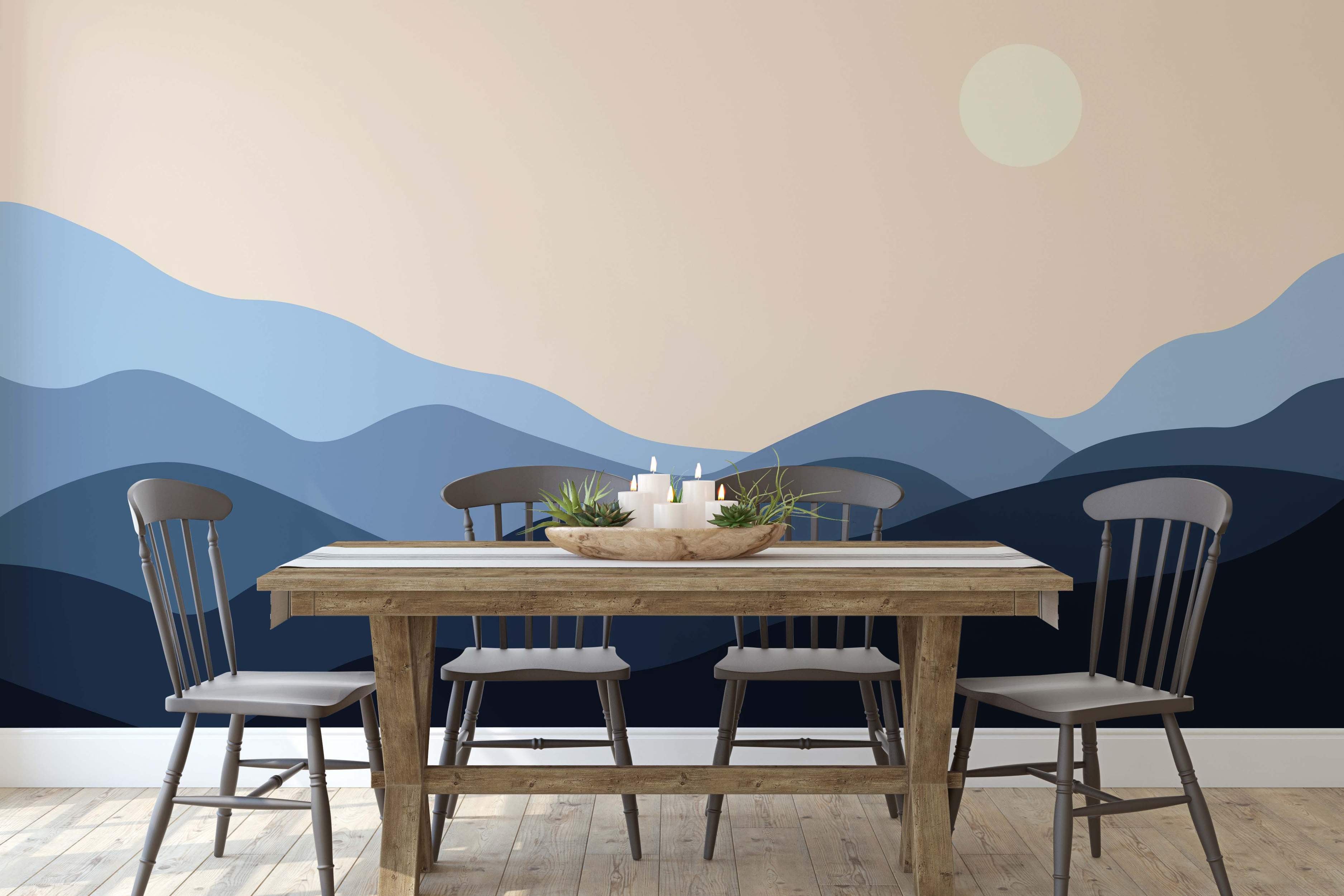 Mural featuring rolling hills in shades of blue under a beige sky with a pale yellow sun.