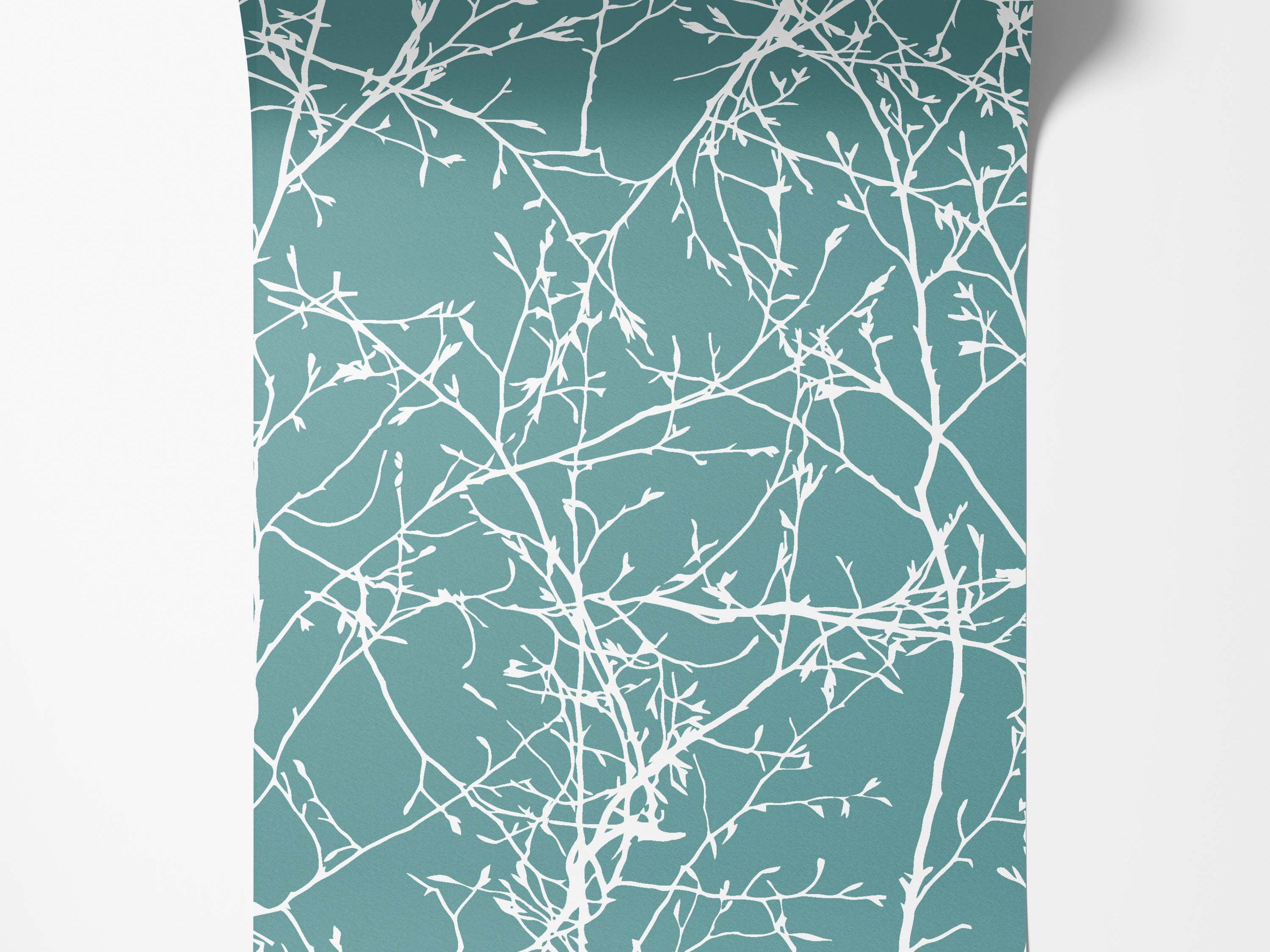 A wallpaper featuring a delicate pattern of white tree branches with small buds on a solid teal background.