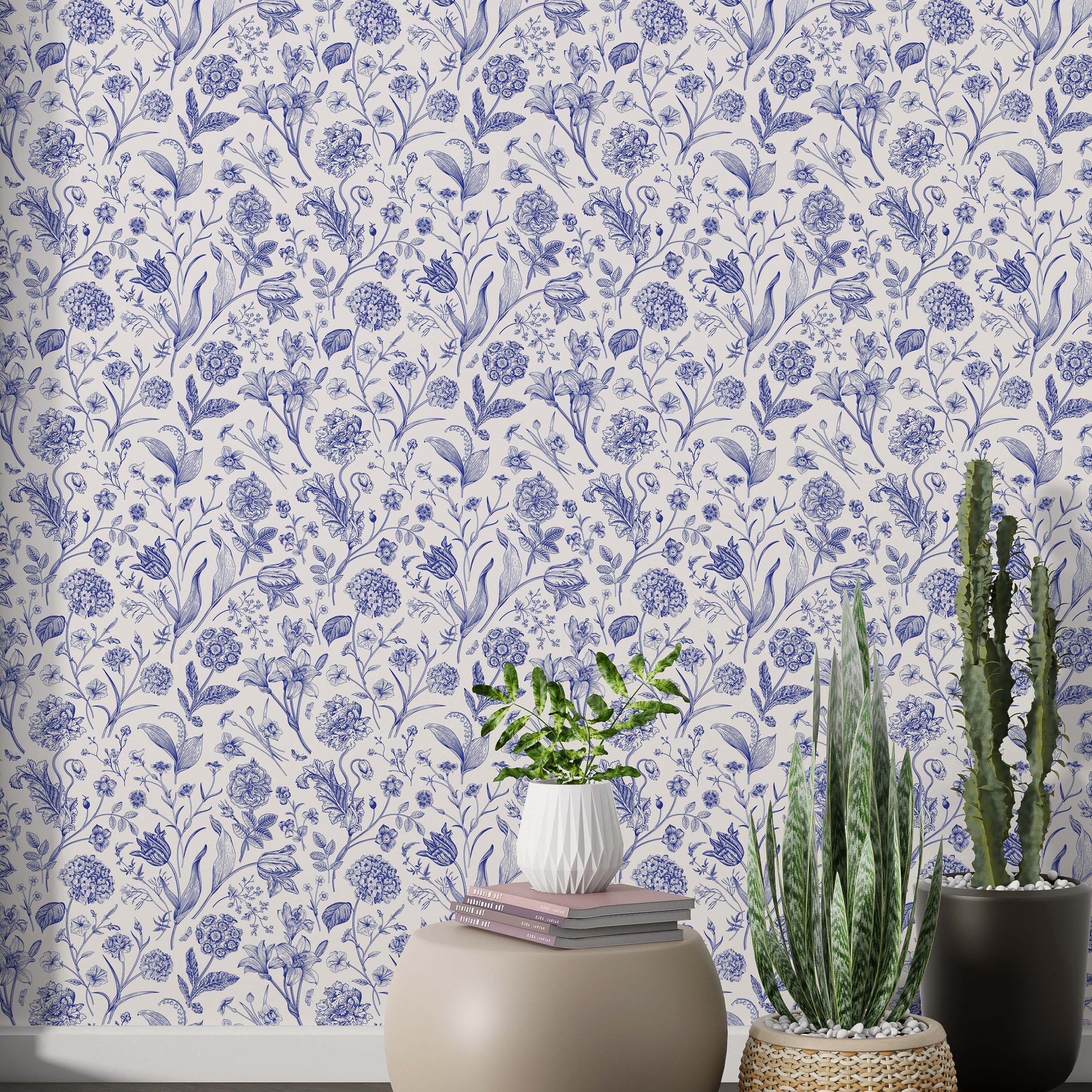 Wallpaper with classic blue botanical illustrations of various flowers like lilies and tulips on a soft white background.