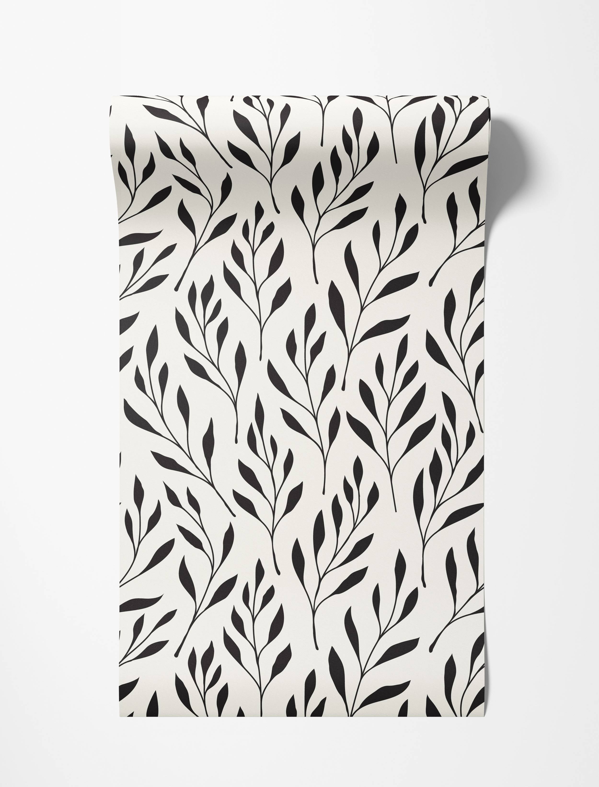 Cream wallpaper with a black botanical print of slender stems and pointed leaves.