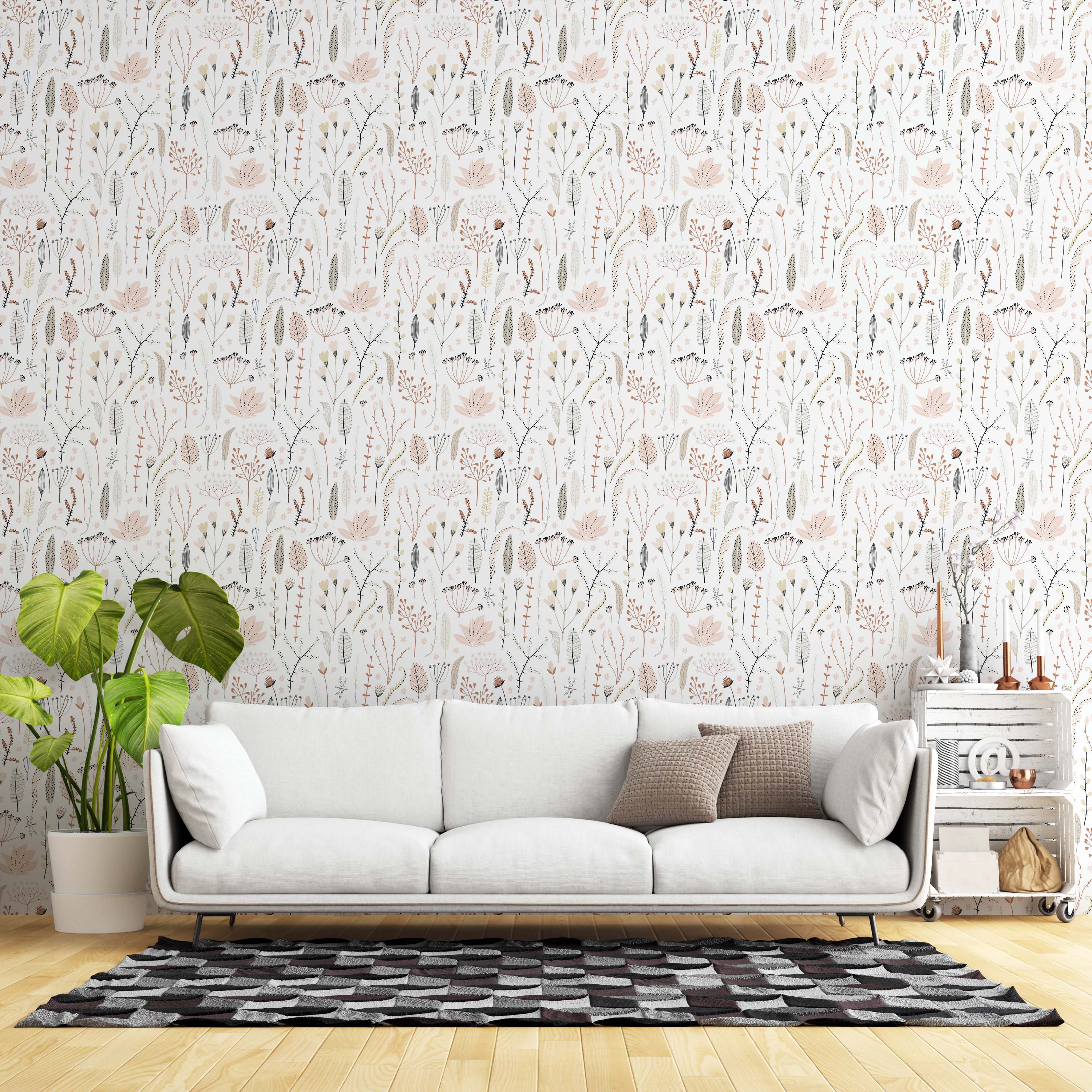 Wallpaper with a delicate botanical print of stylized leaves and sprigs in soft pink, beige, grey, and brown against a white background.