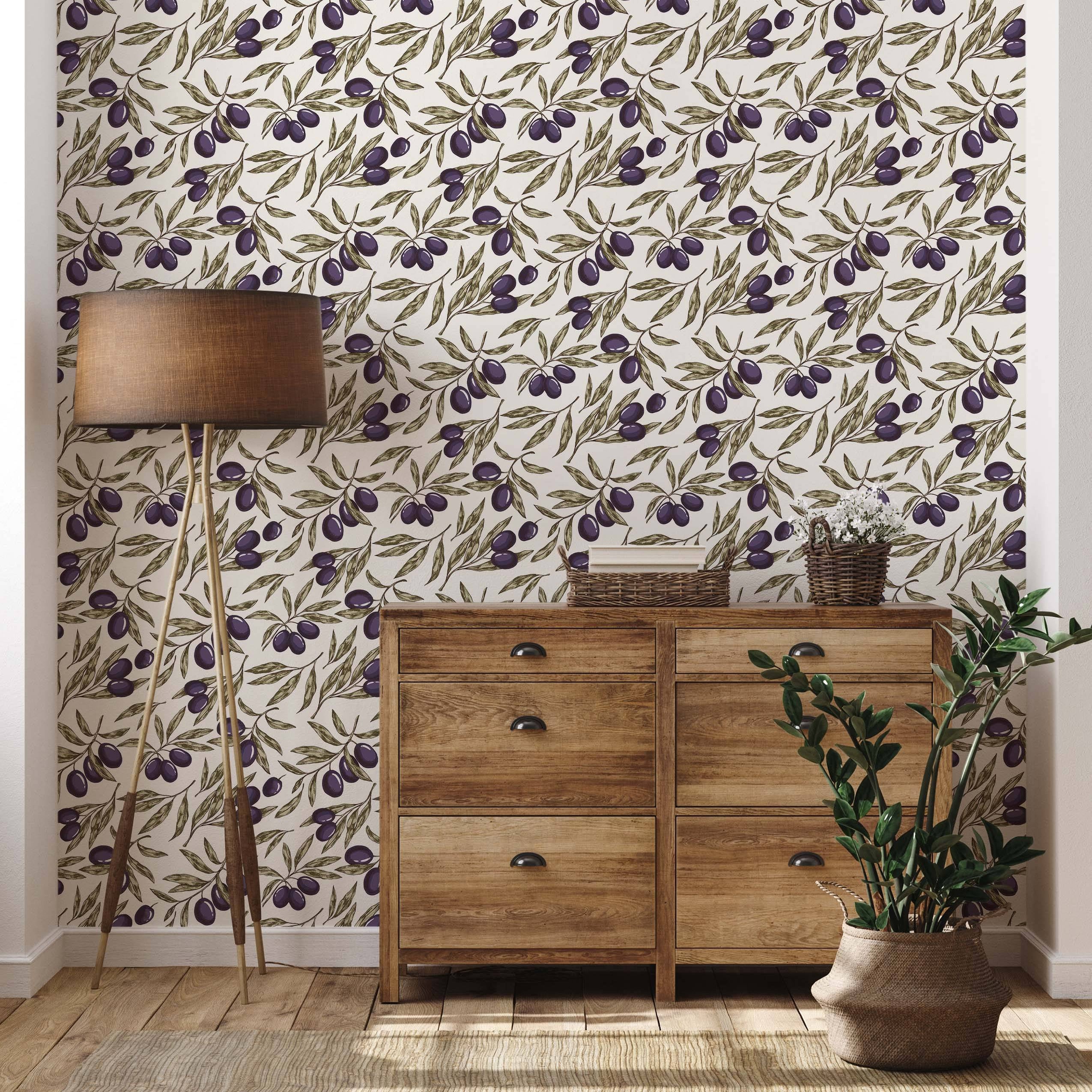 Wallpaper with a repeating pattern of olive branches, featuring purple olives and green leaves on a light cream background.
